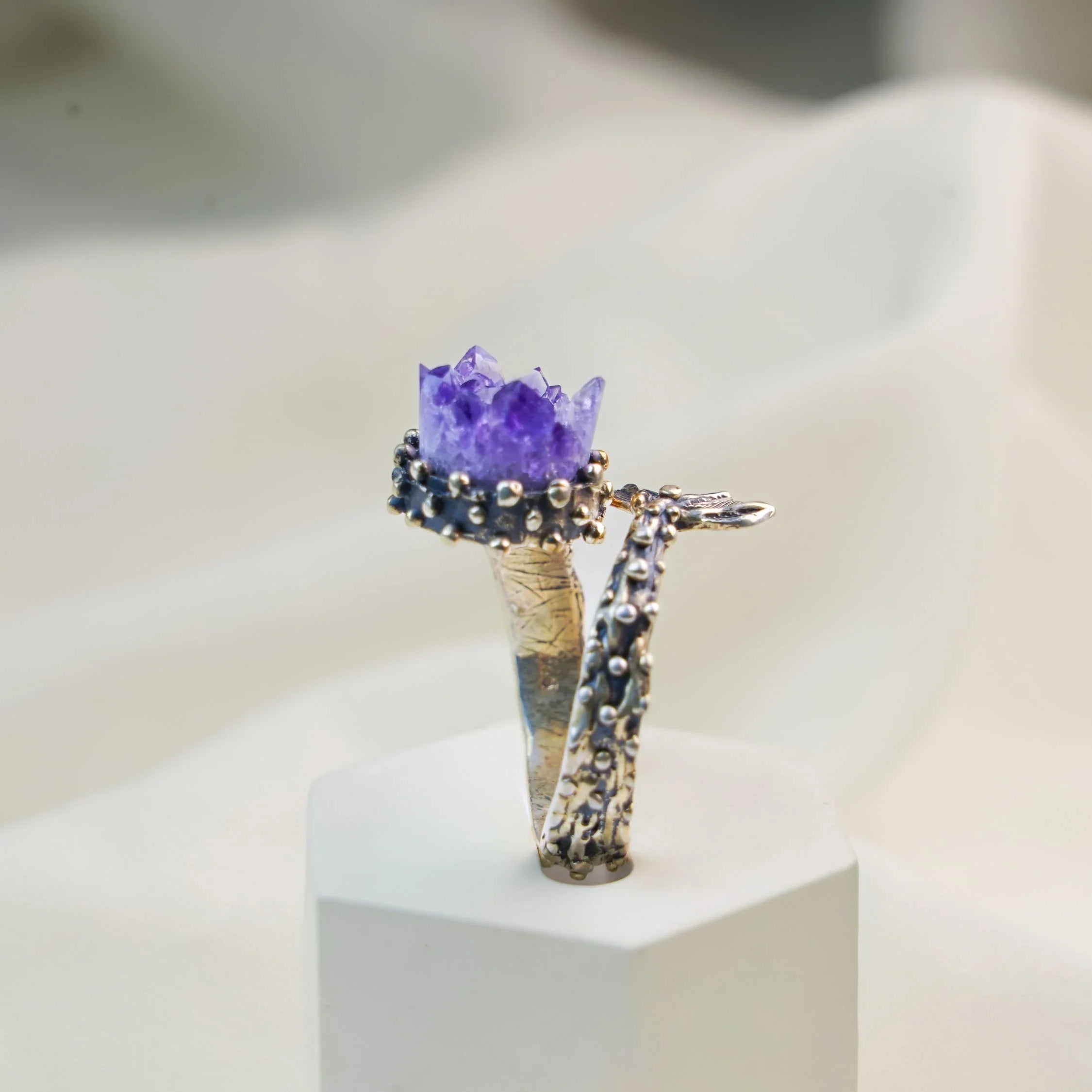 Amethyst ring vertical view showing band and gemstone structure