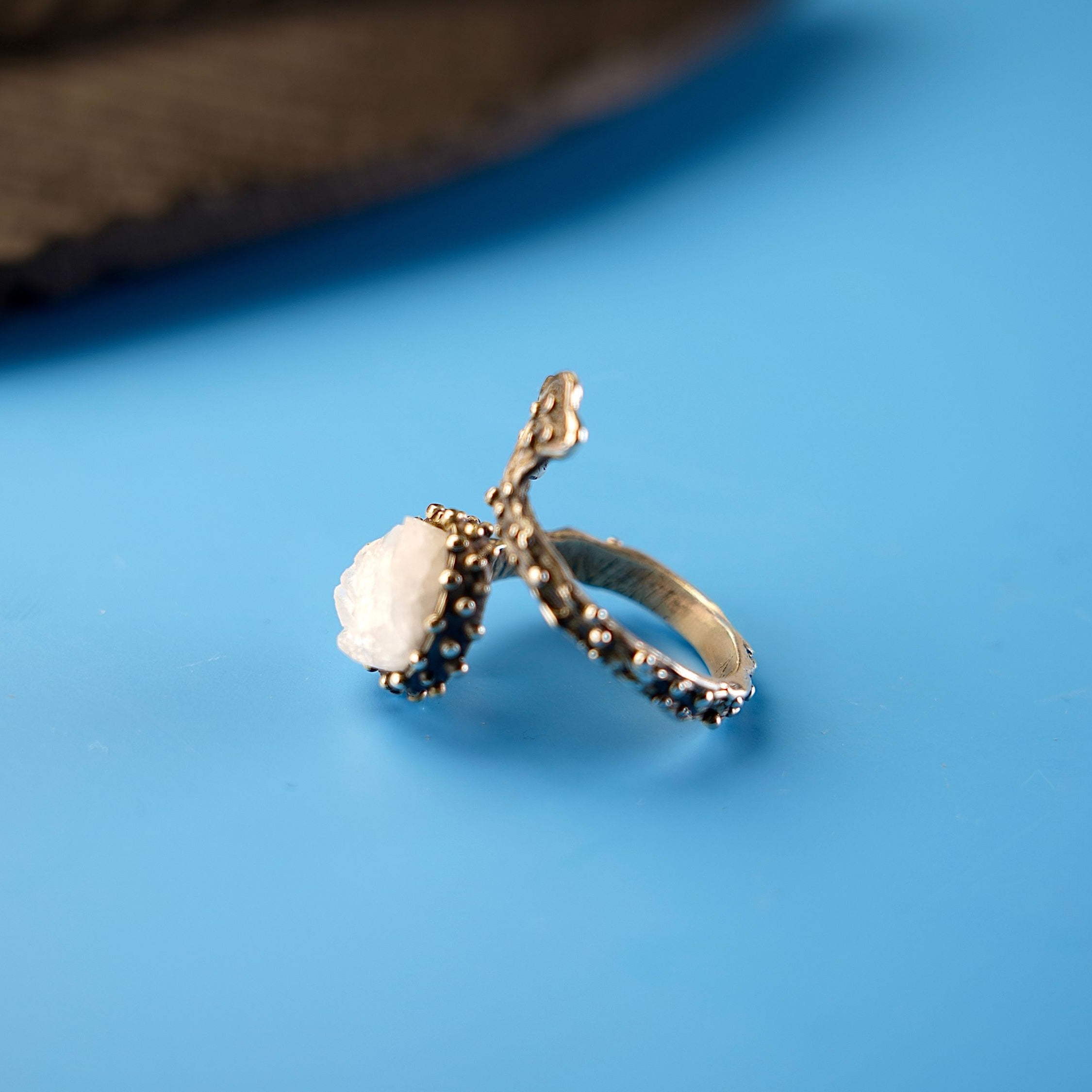 Side profile moonstone ring adjustable band structure sterling silver detail