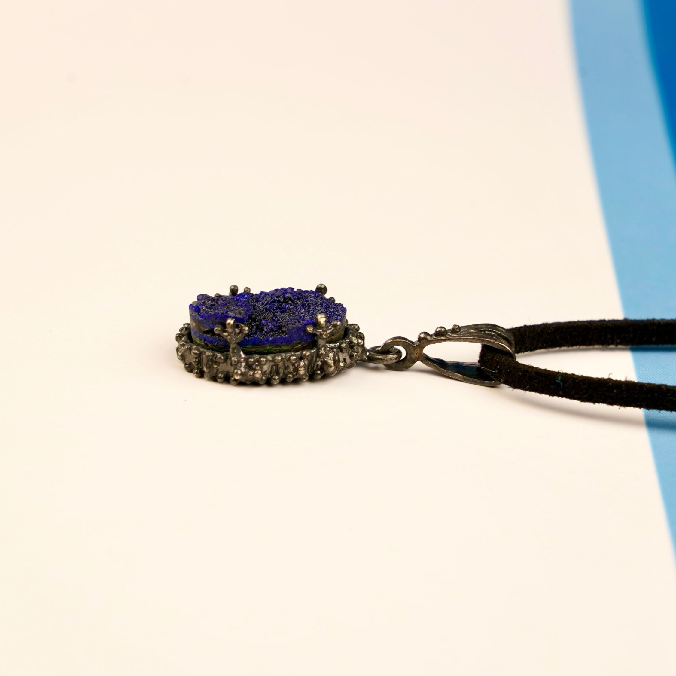 lapis lazuli pendant side profile, raw stone thickness and silver setting detail