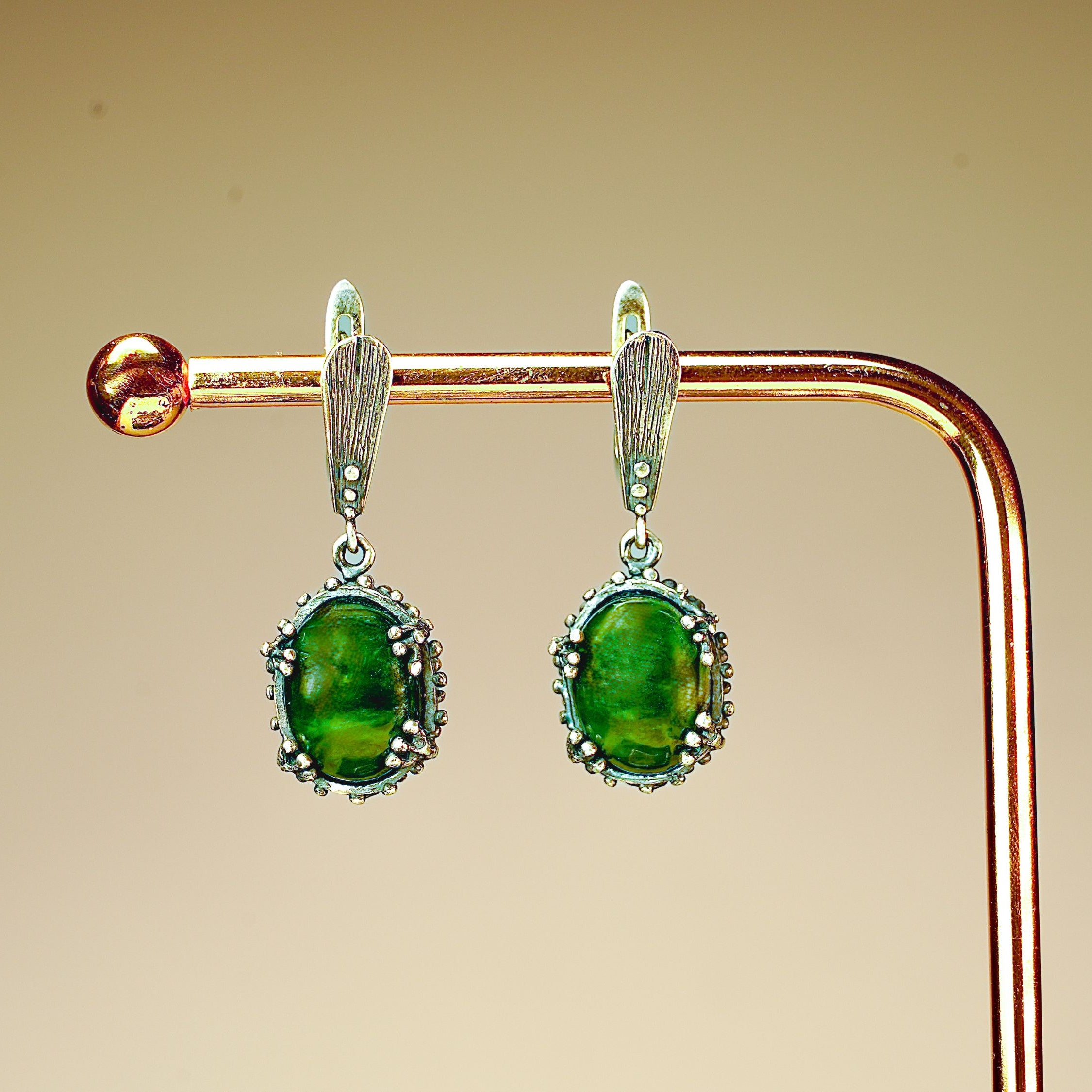 Side profile jade earrings leverback closure silver structure detail
