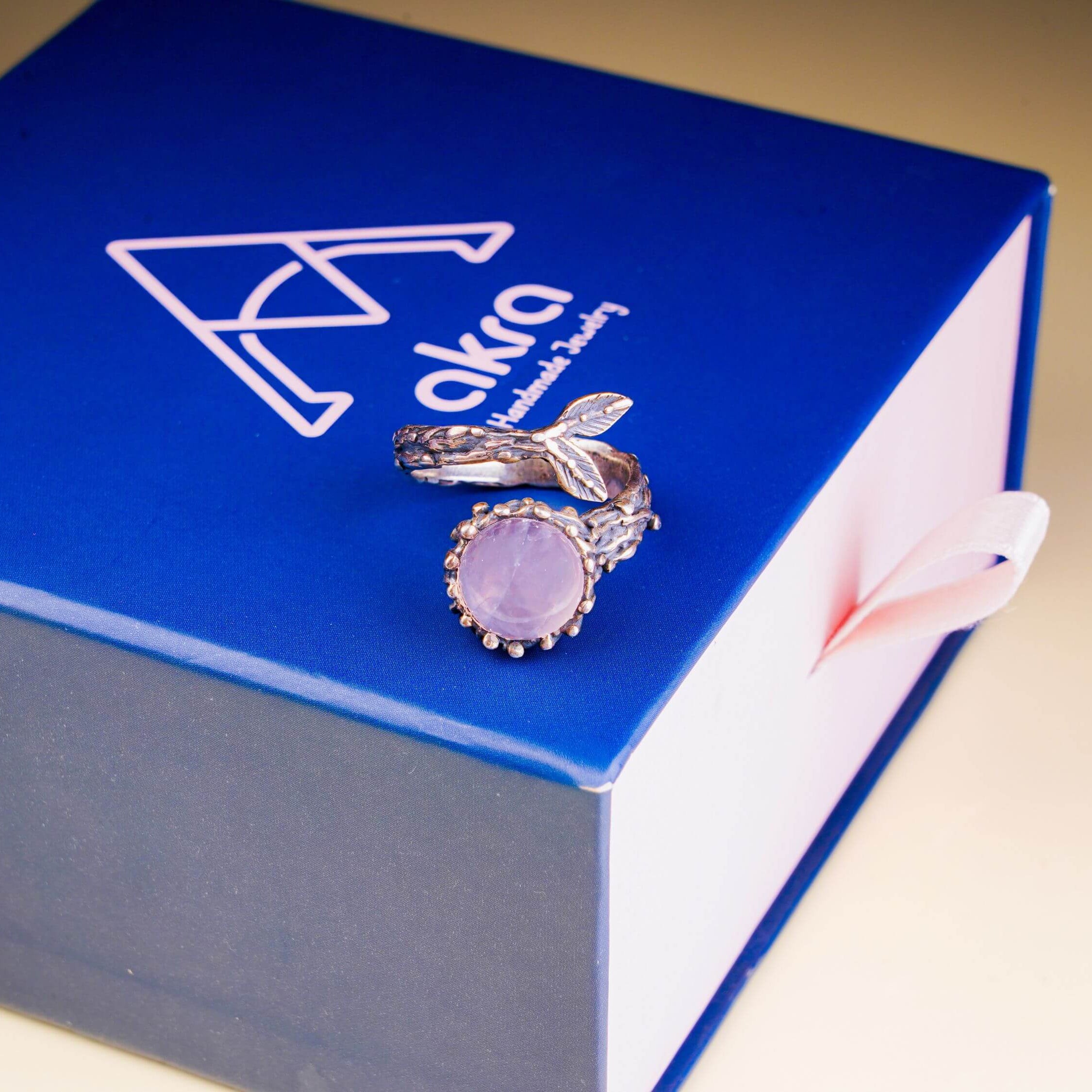 Rose quartz branch ring presented on an Akra Gems premium blue luxury gift box