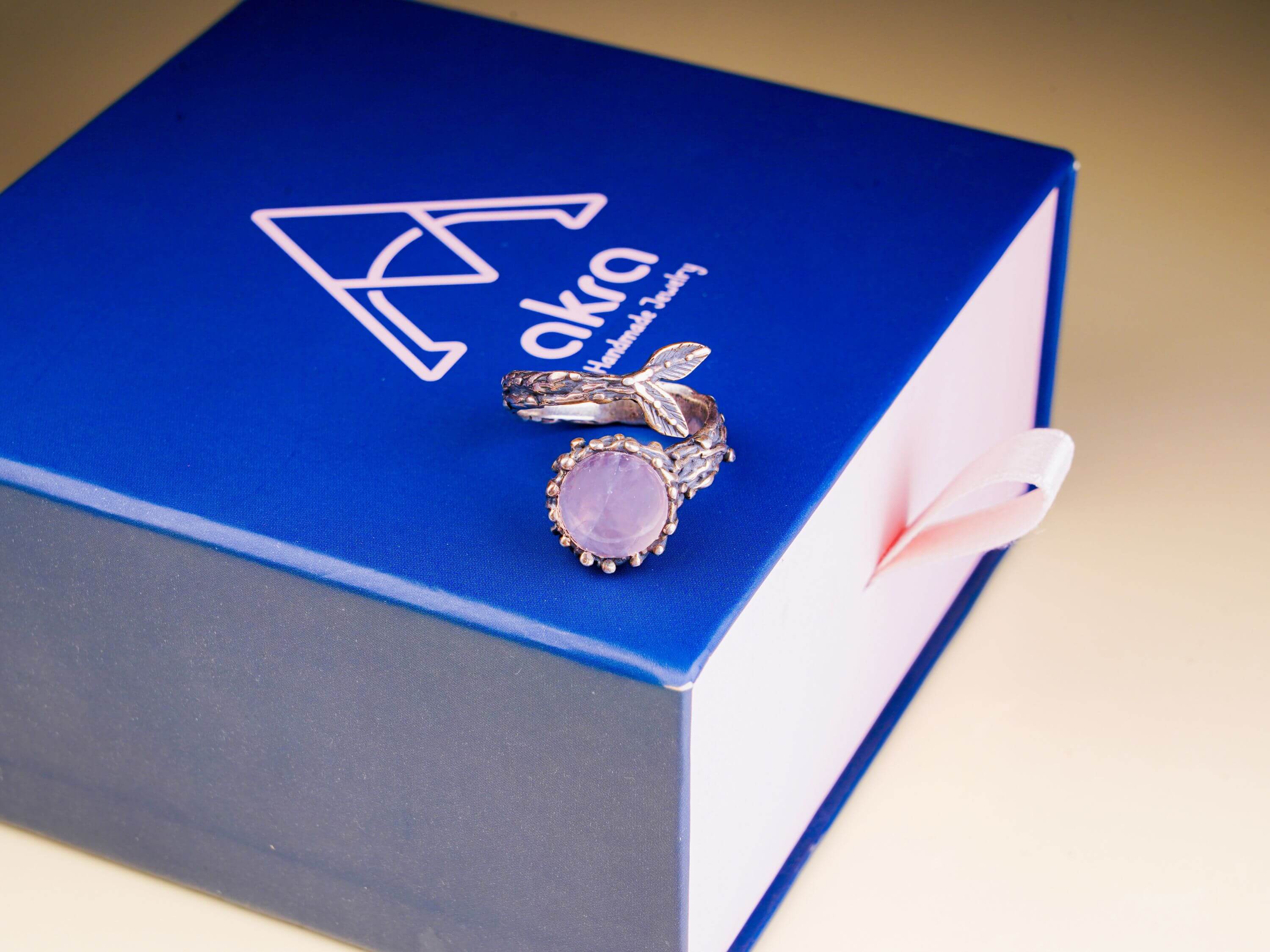 Rose quartz branch ring presented on an Akra Gems premium blue luxury gift box