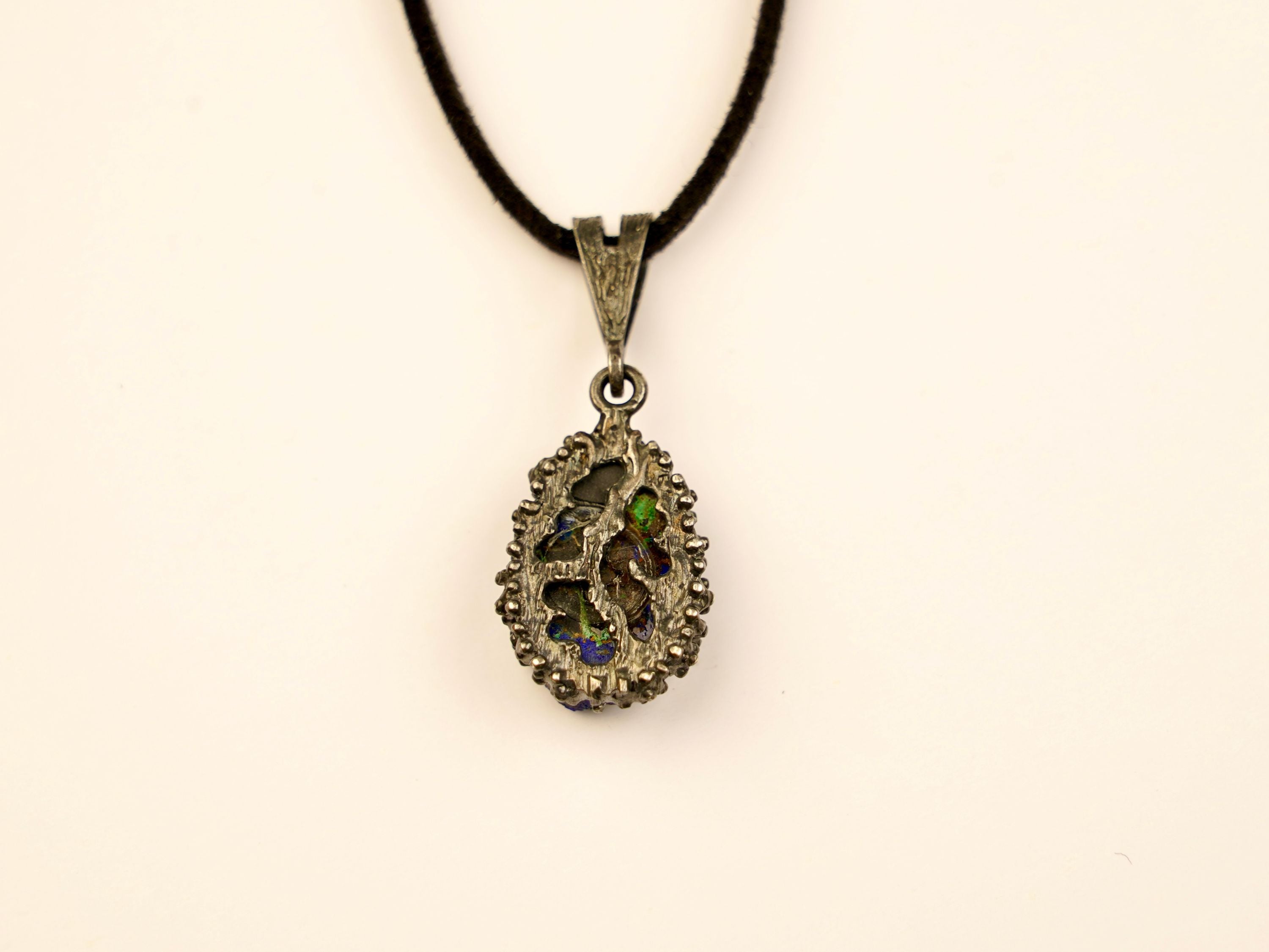 backside of lapis lazuli pendant, handcrafted sterling silver jewelry detail