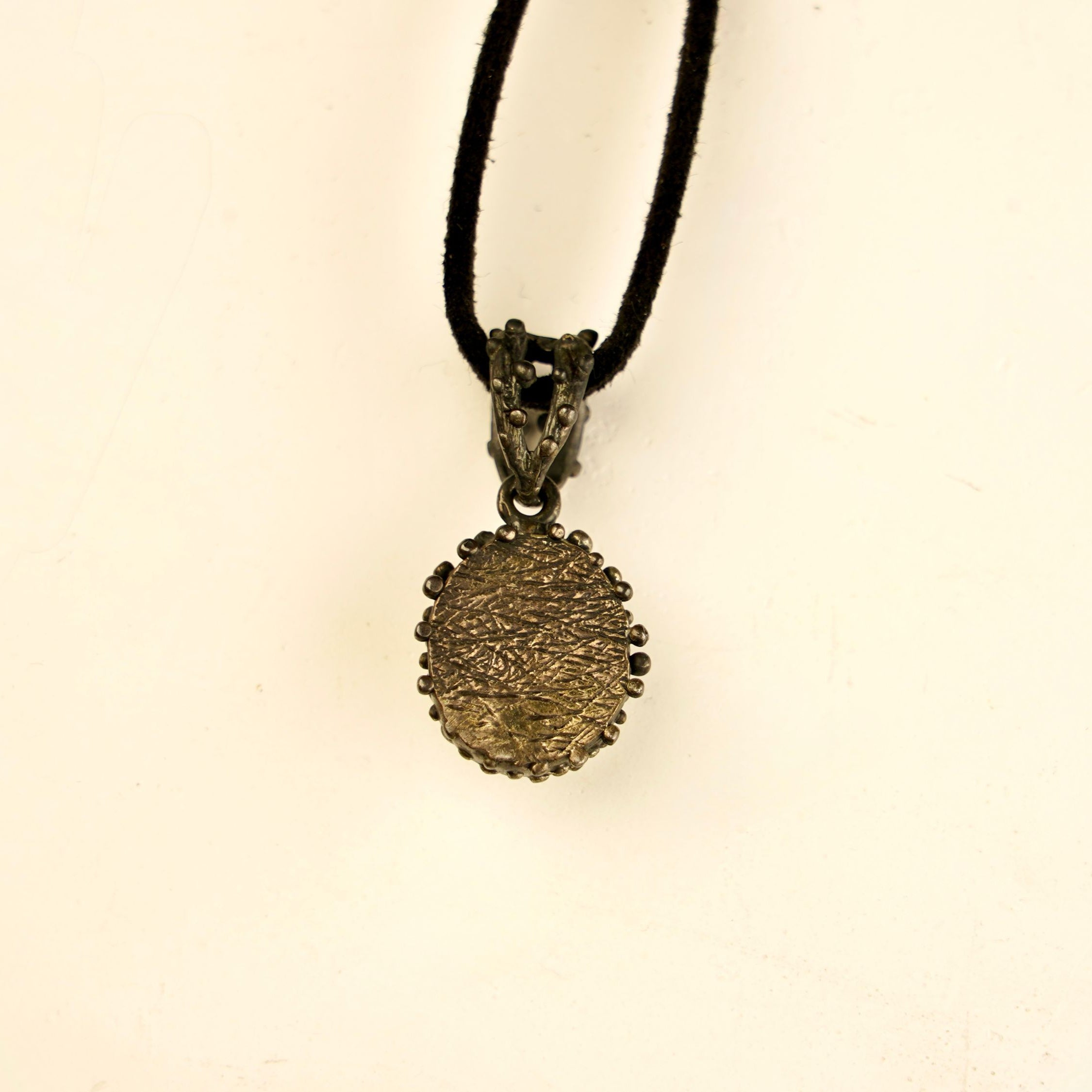 backside of moonstone pendant, sterling silver handcrafted jewelry detail