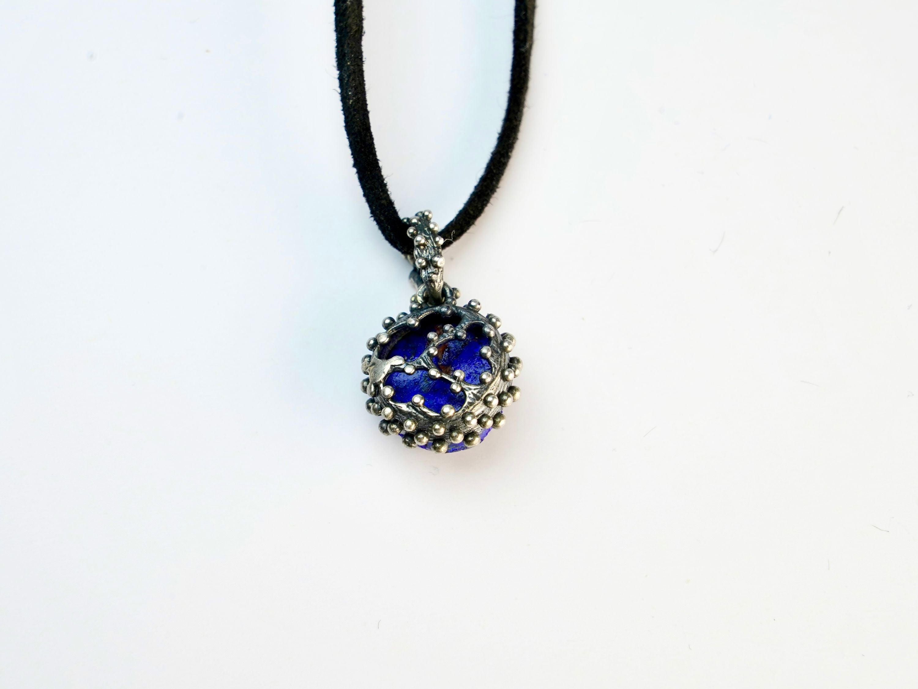 backside of lapis lazuli pendant, clean sterling silver craftsmanship