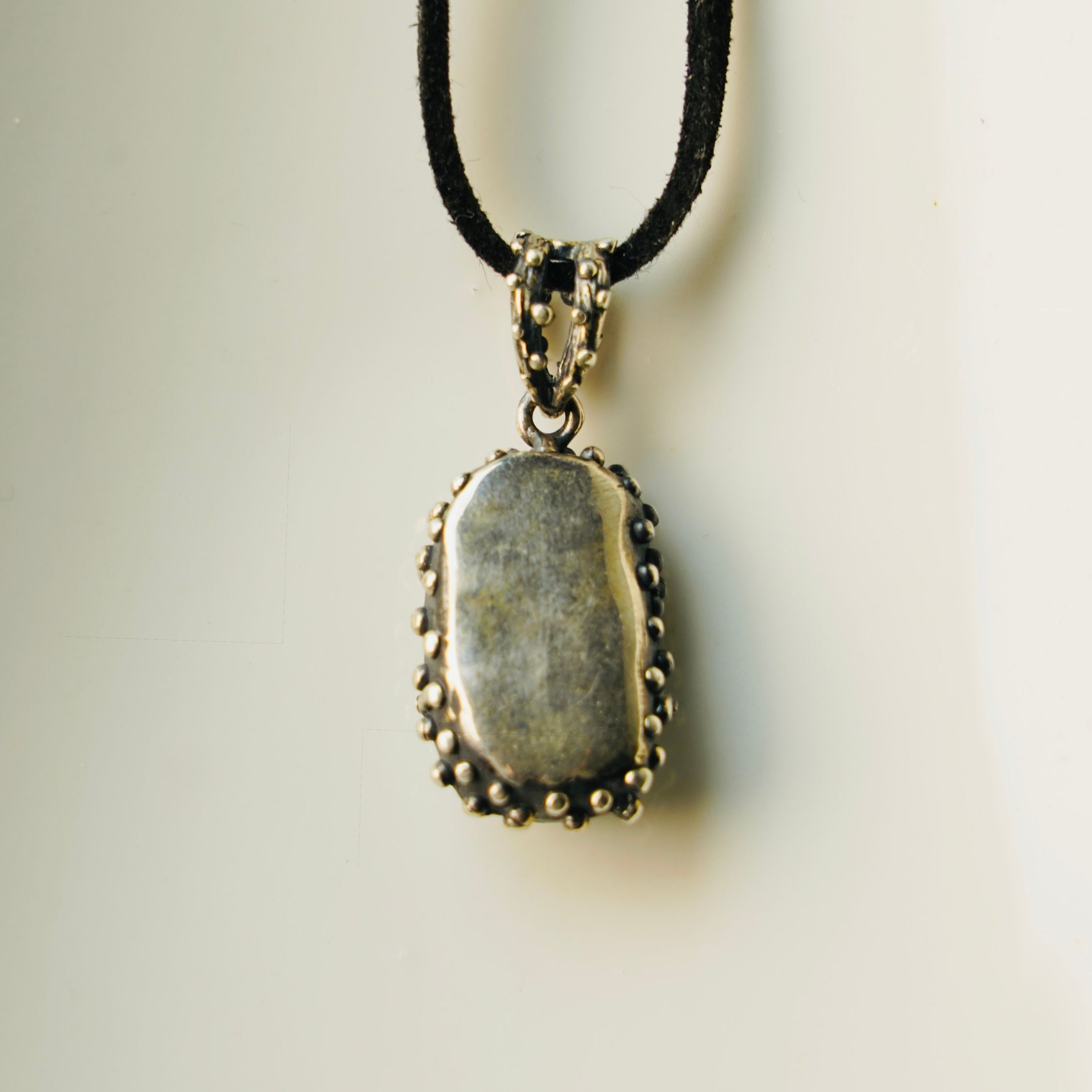 Backside aquamarine pendant silver craftsmanship detail rear view necklace