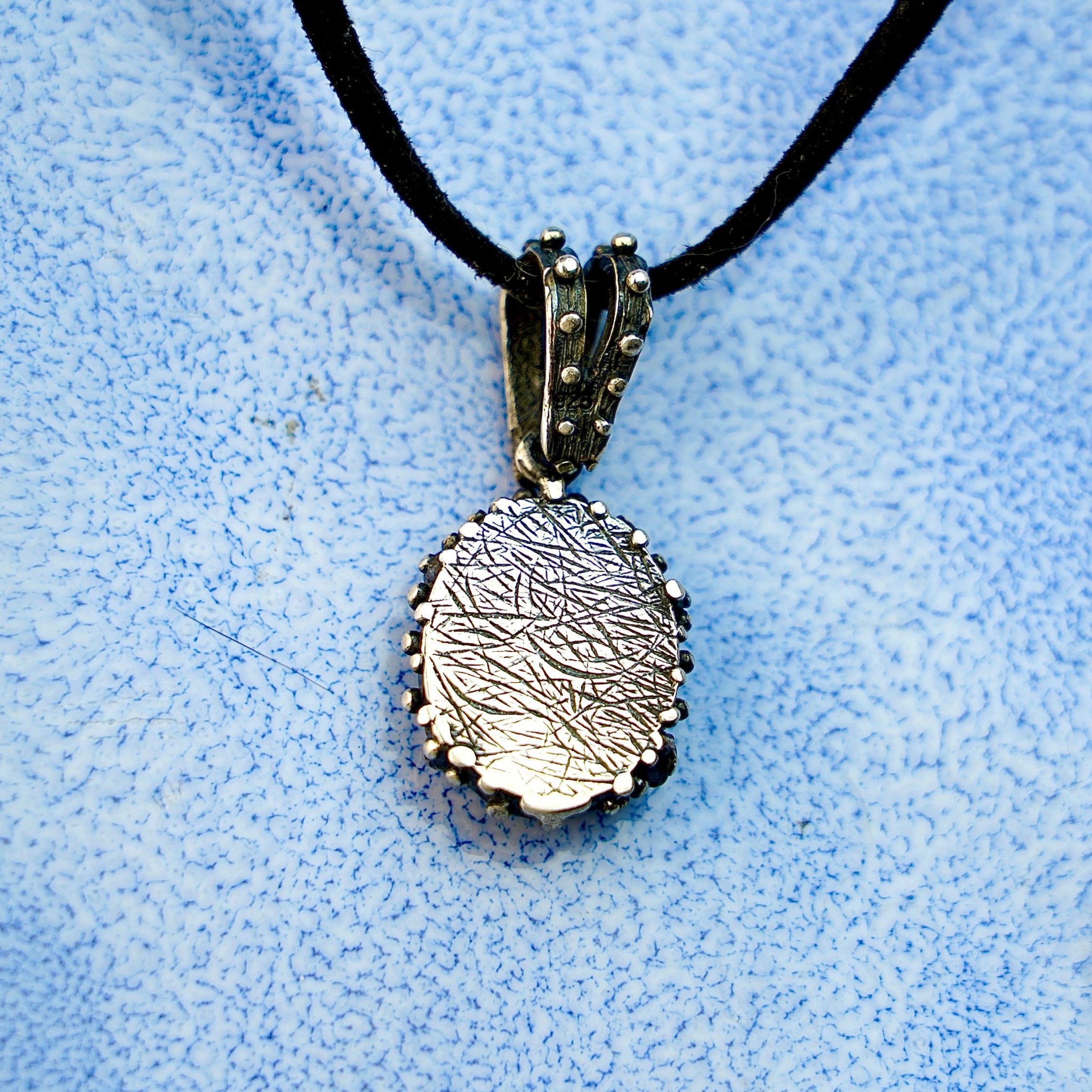 Backside labradorite pendant rear view silver setting necklace detail