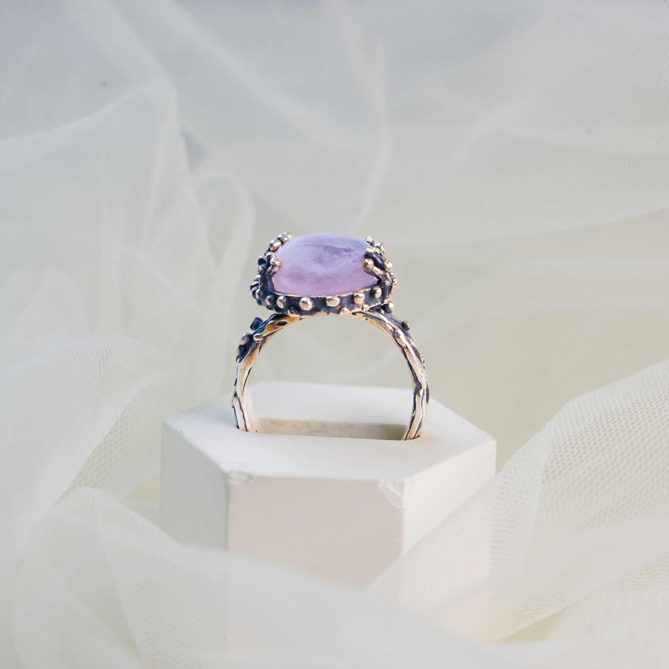 rose quartz ring profile view pink gemstone elevated setting ring