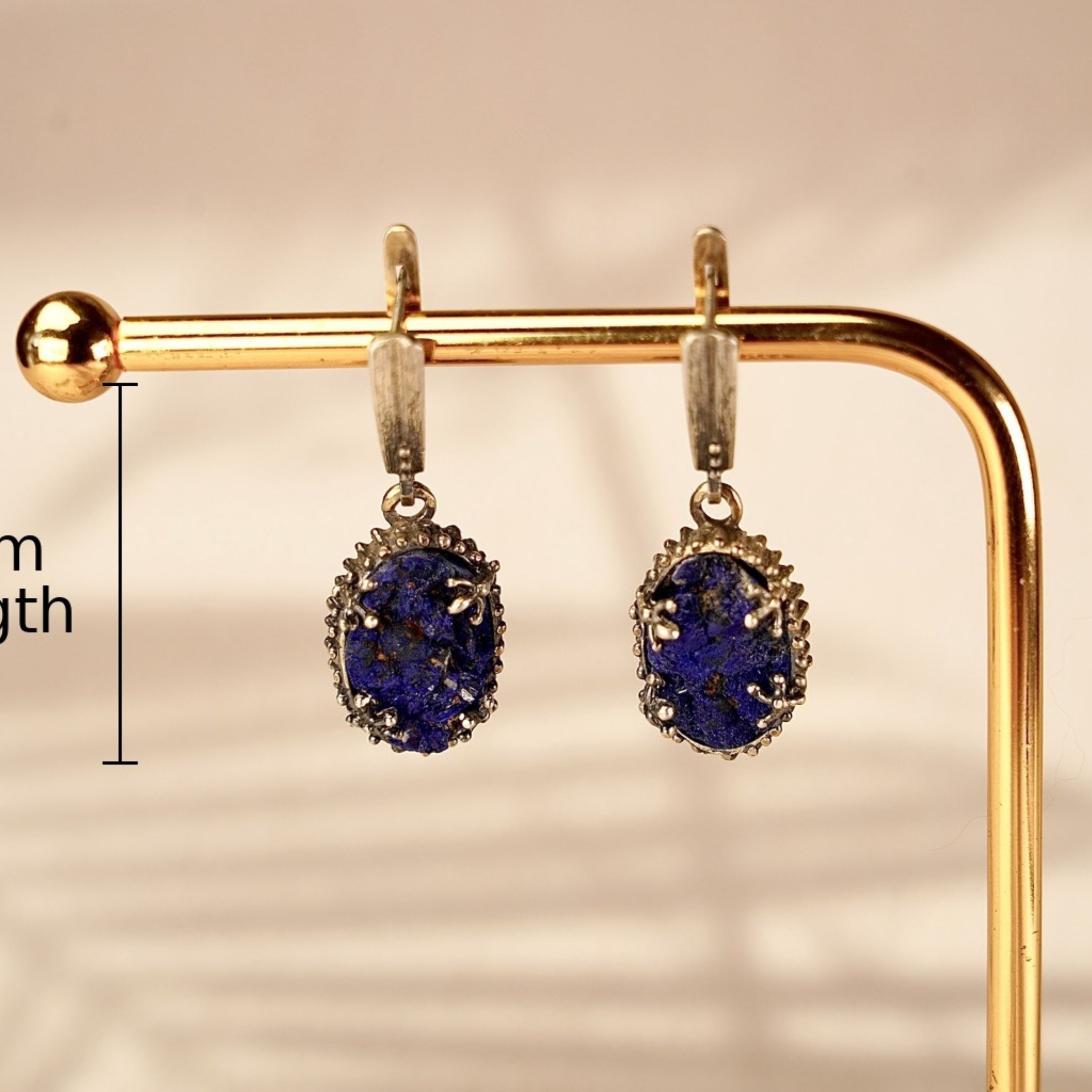 Alternative close up lapis lazuli earrings textured blue stone macro detail