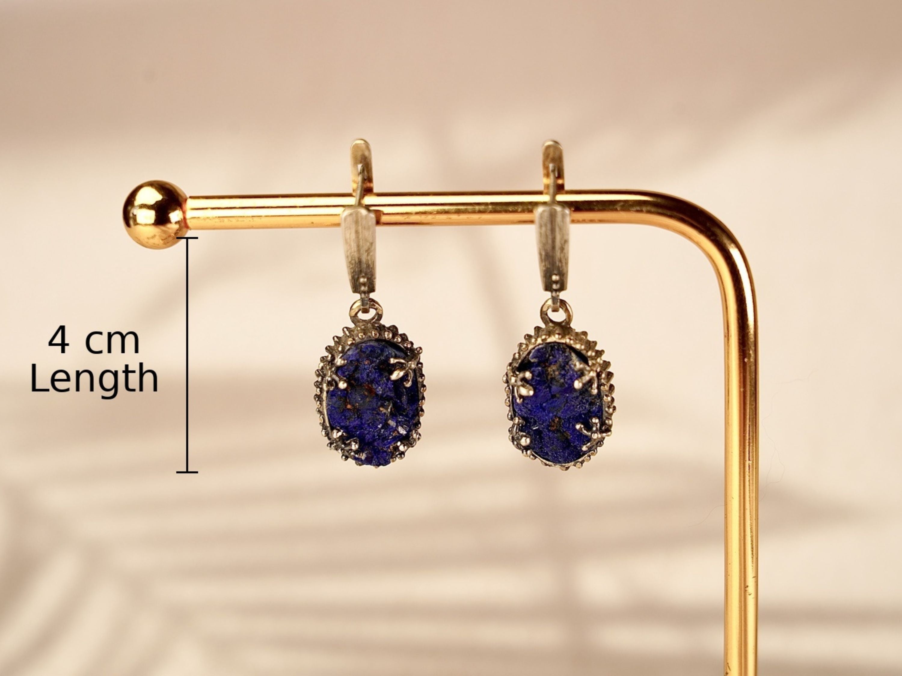 Alternative close up lapis lazuli earrings textured blue stone macro detail