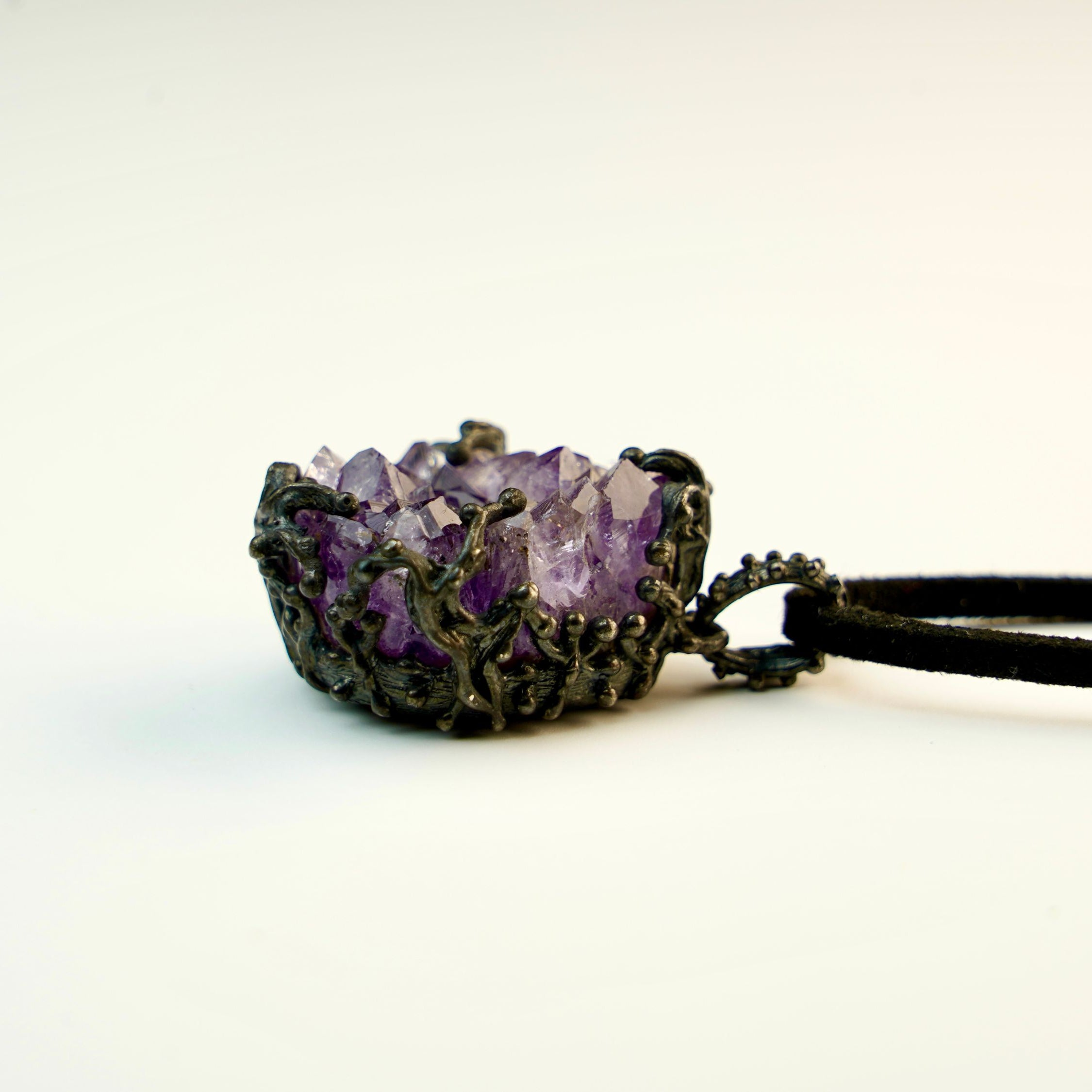 low angle amethyst crystal pendant, raw gemstone structure detail