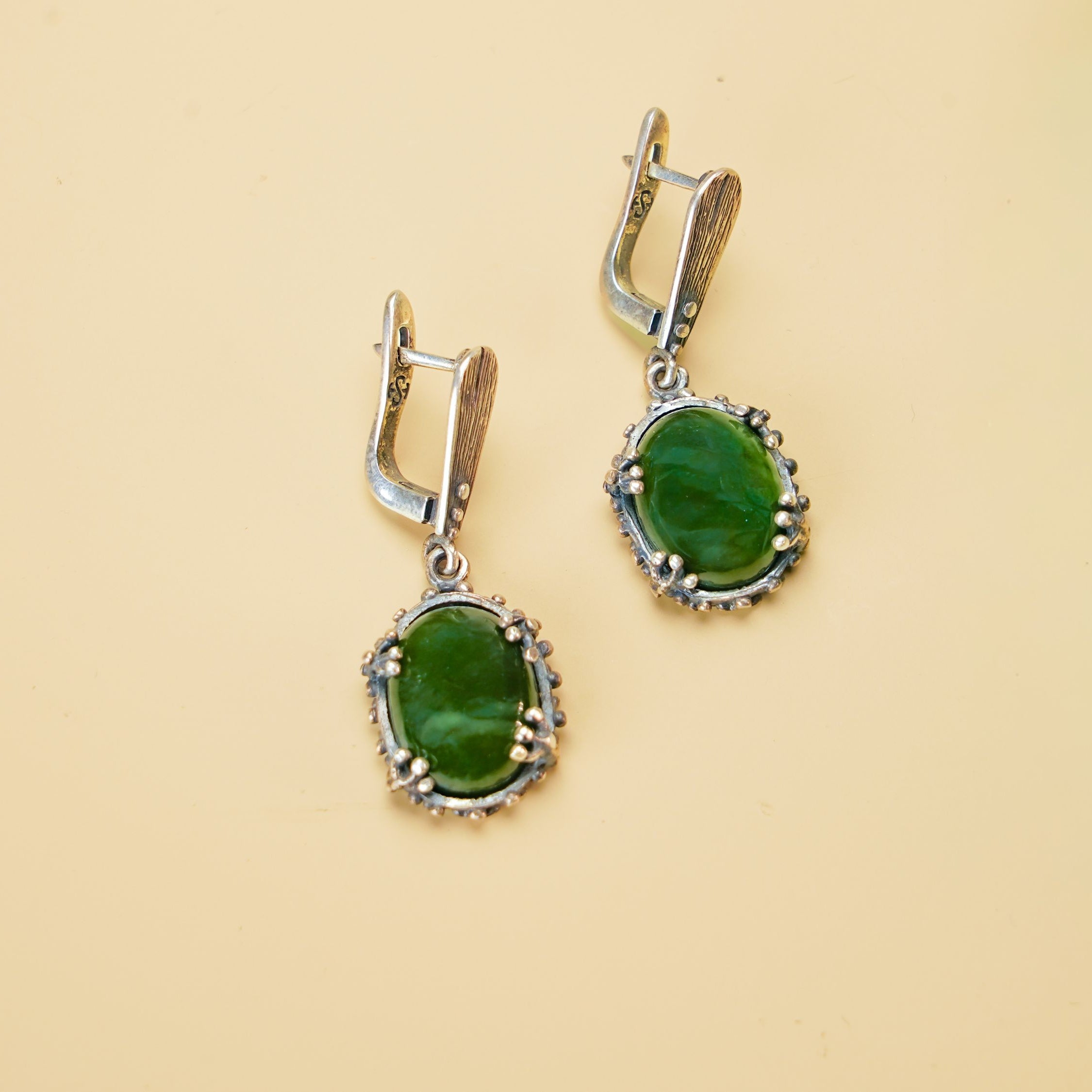 Alternative close up jade earrings green gemstone macro detail silver setting