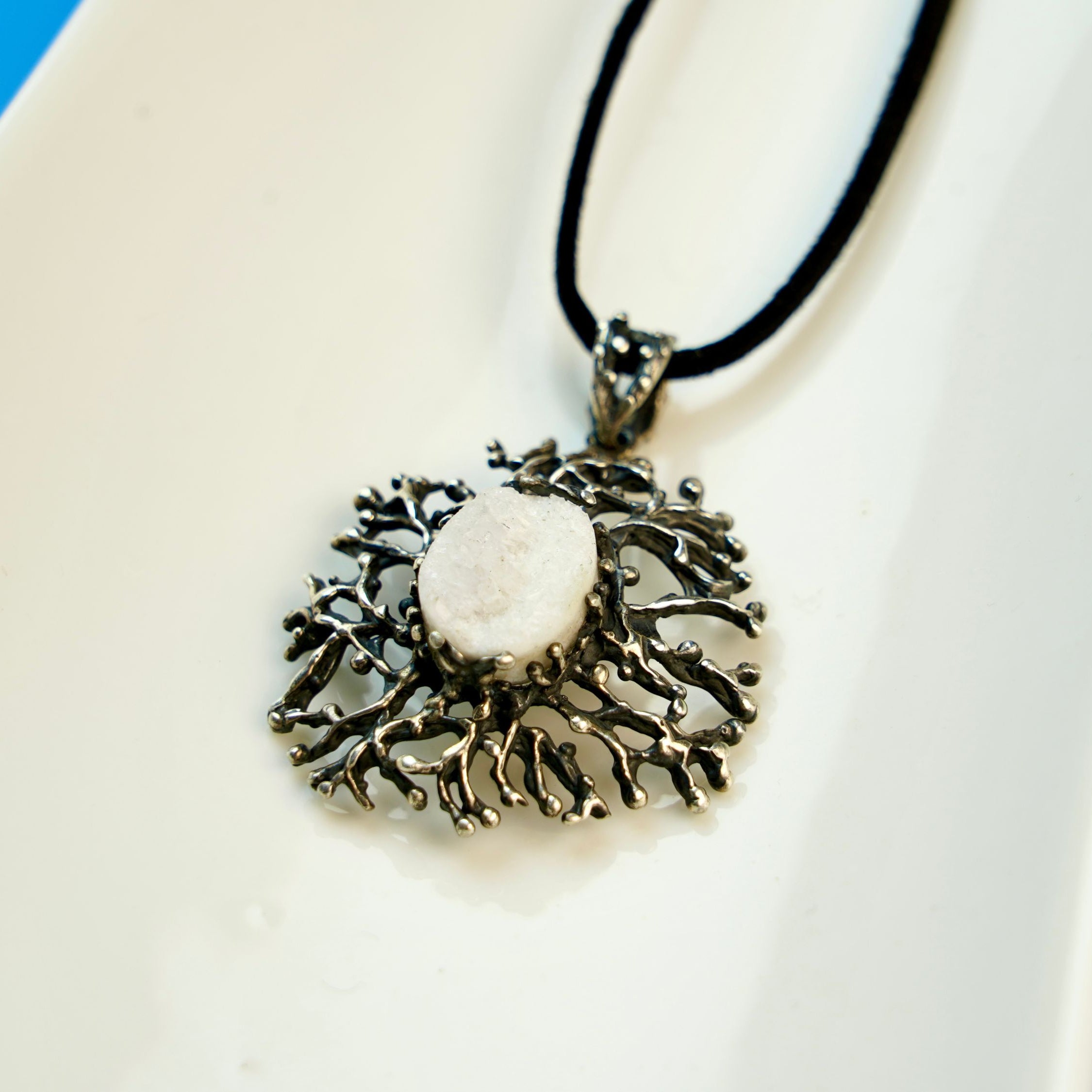 moonstone pendant detail view, organic branch-like silver craftsmanship