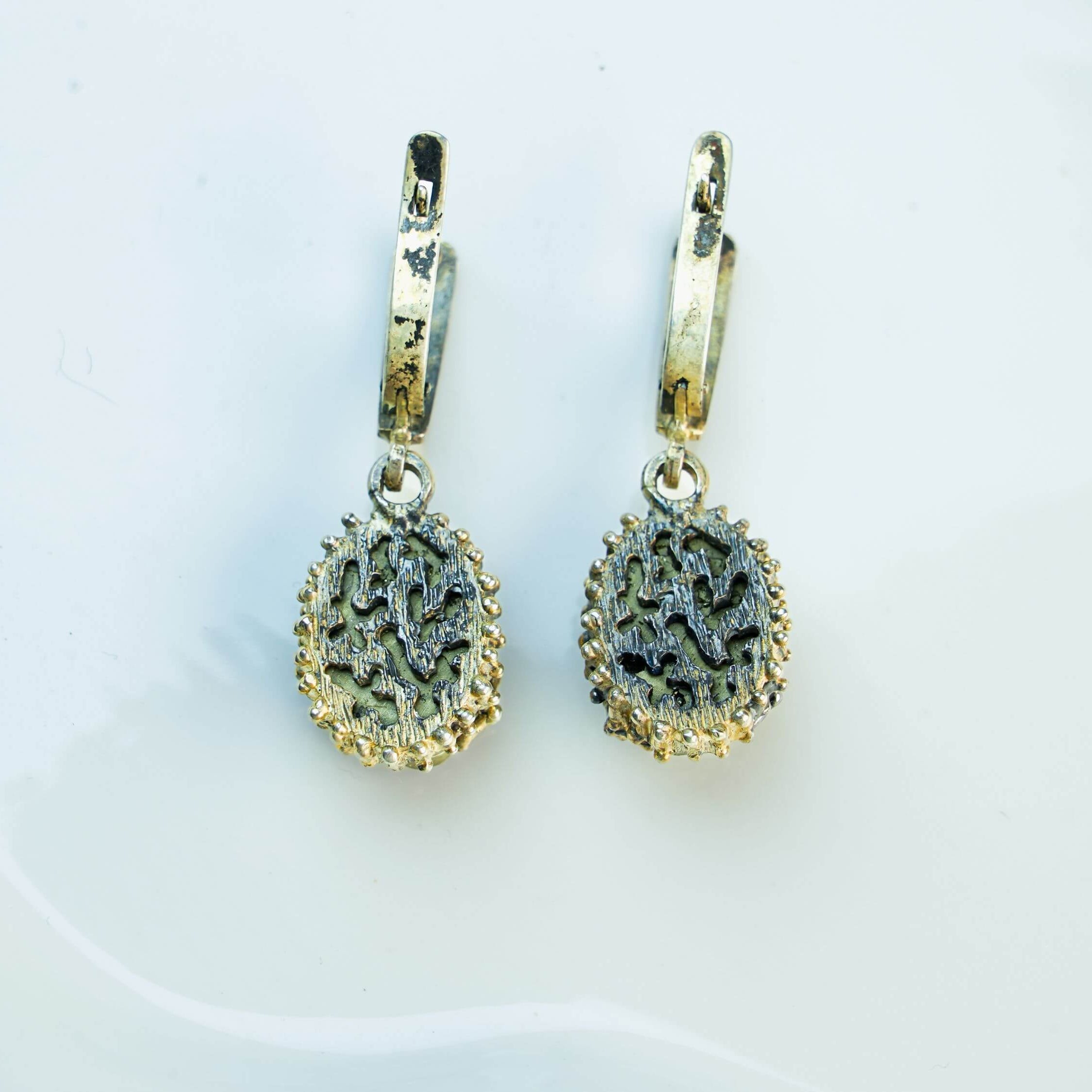 The back of the pyrite earring, showing the 925 sterling silver hallmark and the secure, high-quality leverback closure