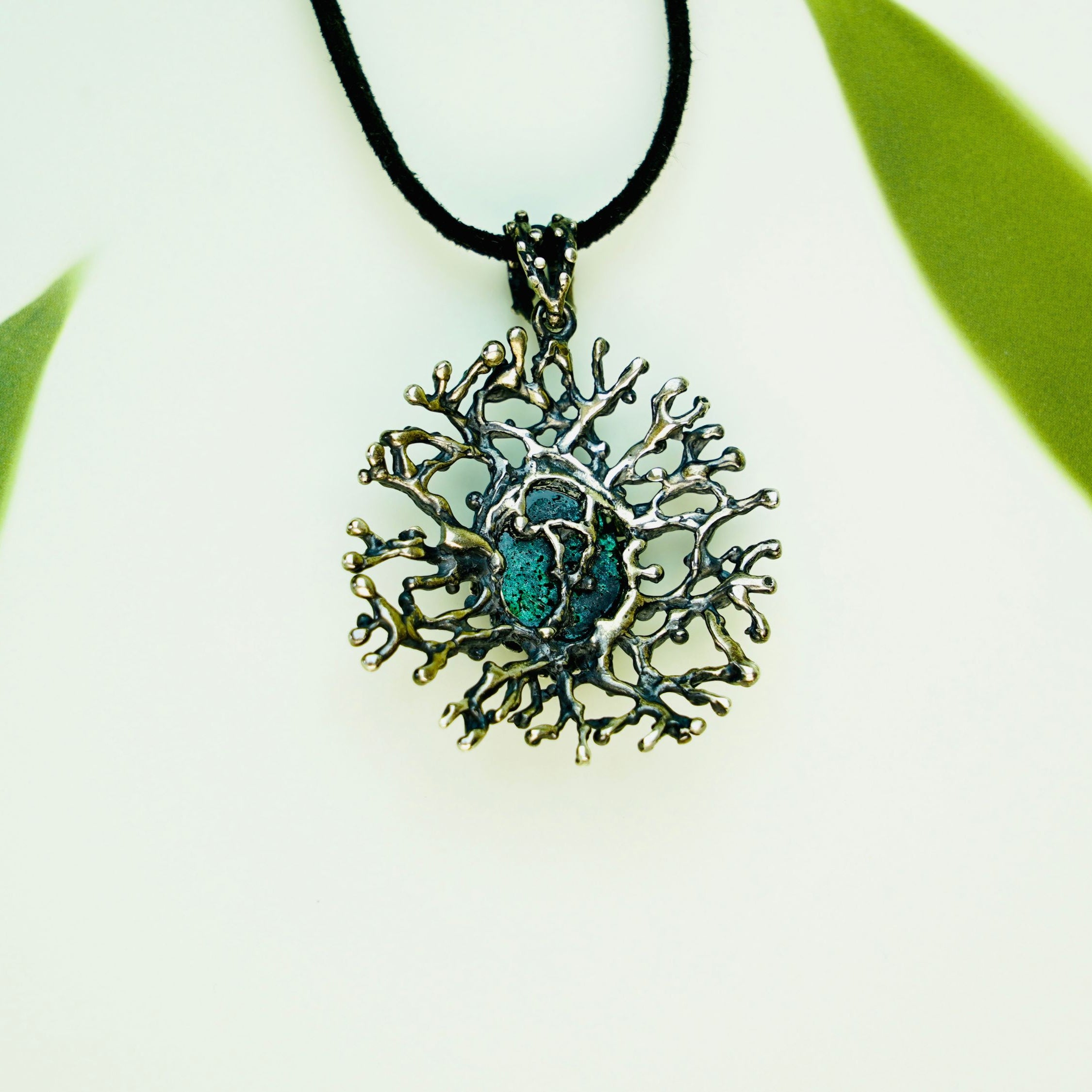 Malachite necklace backside view silver setting detail natural gemstone pendant