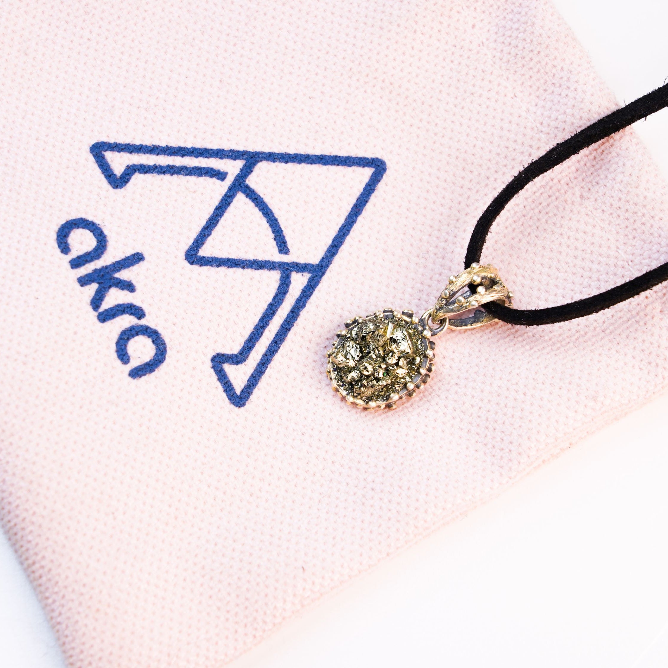pyrite necklace lifestyle shot elegant gold jewelry akra brand