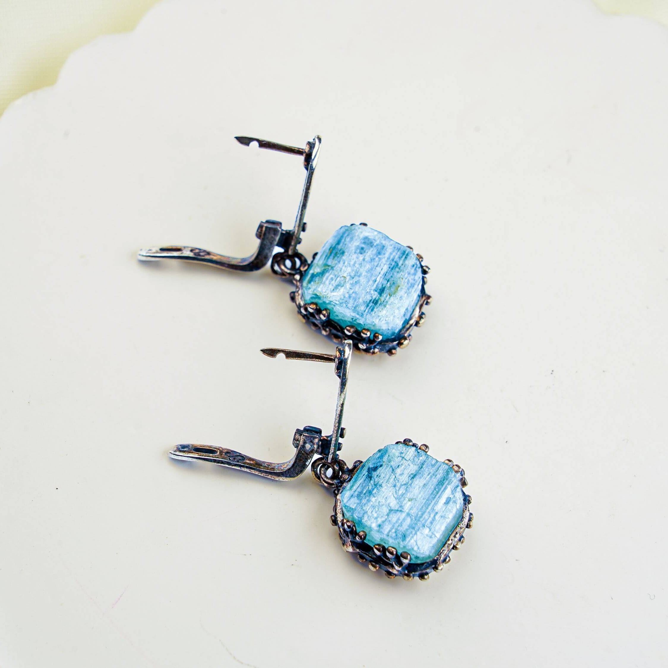 Alternative close up aquamarine earrings raw aqua crystal macro detail variation