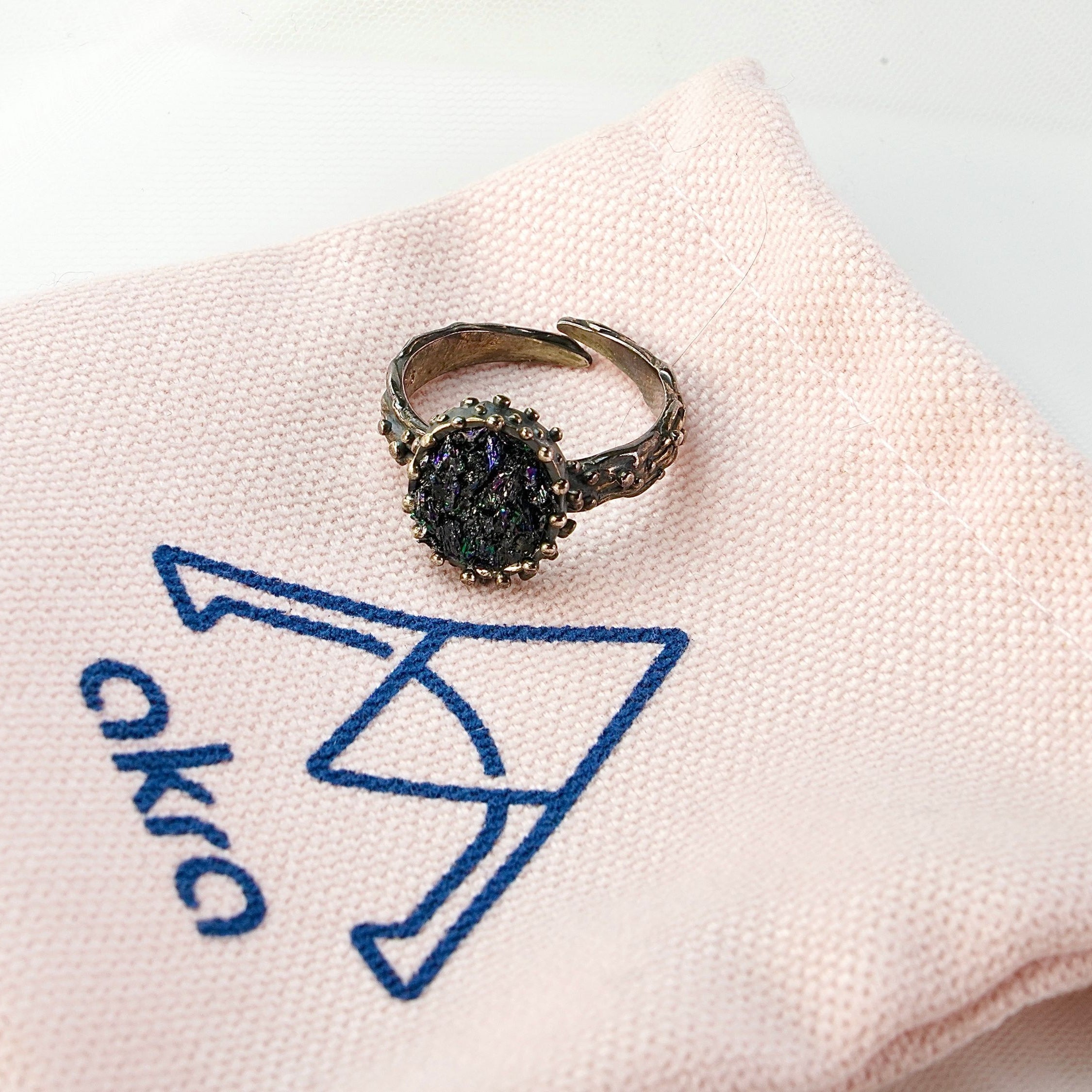 Lifestyle raw tourmaline adjustable ring gothic aesthetic dark gemstone jewelry composition