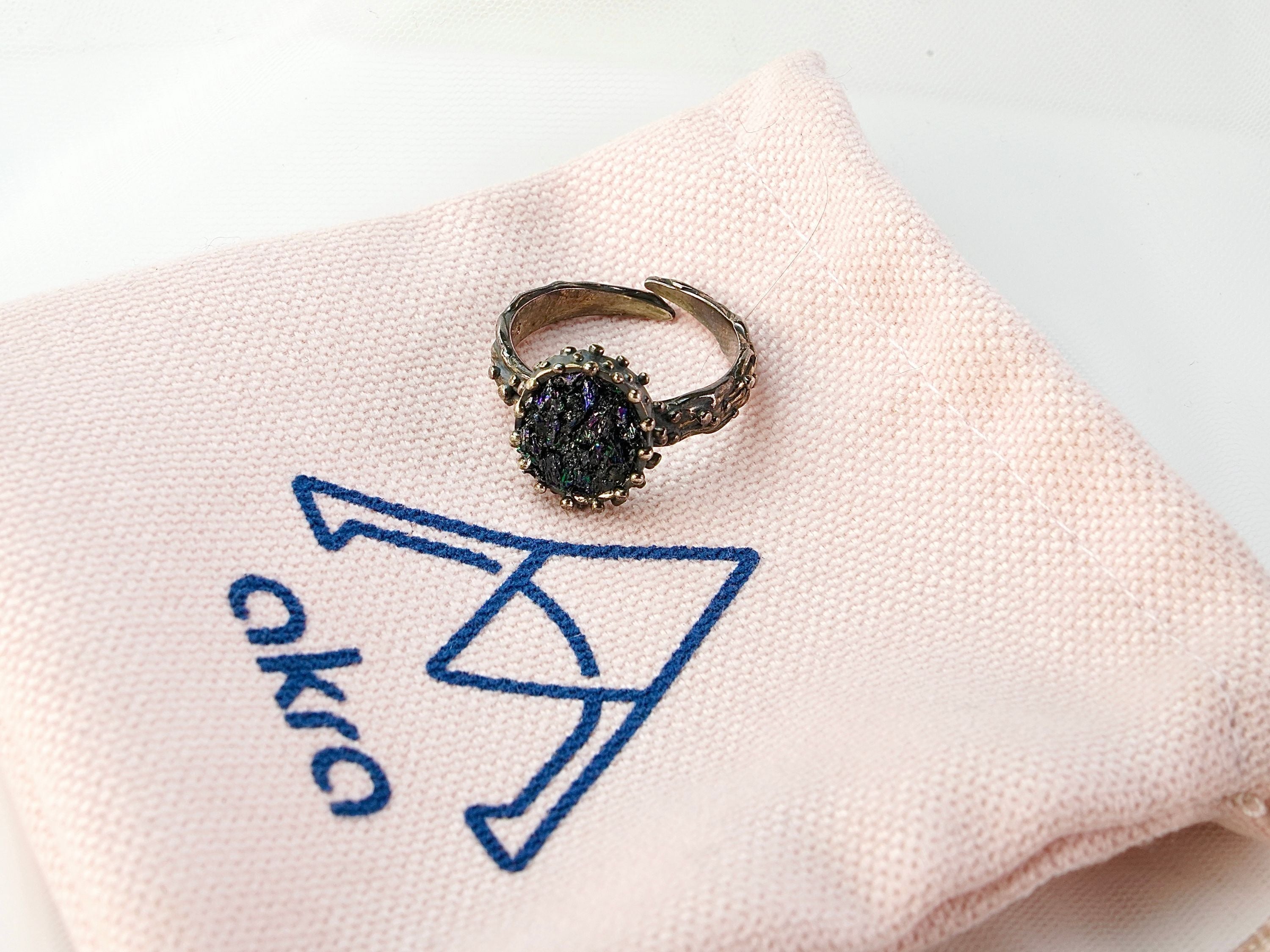 Lifestyle raw tourmaline adjustable ring gothic aesthetic dark gemstone jewelry composition