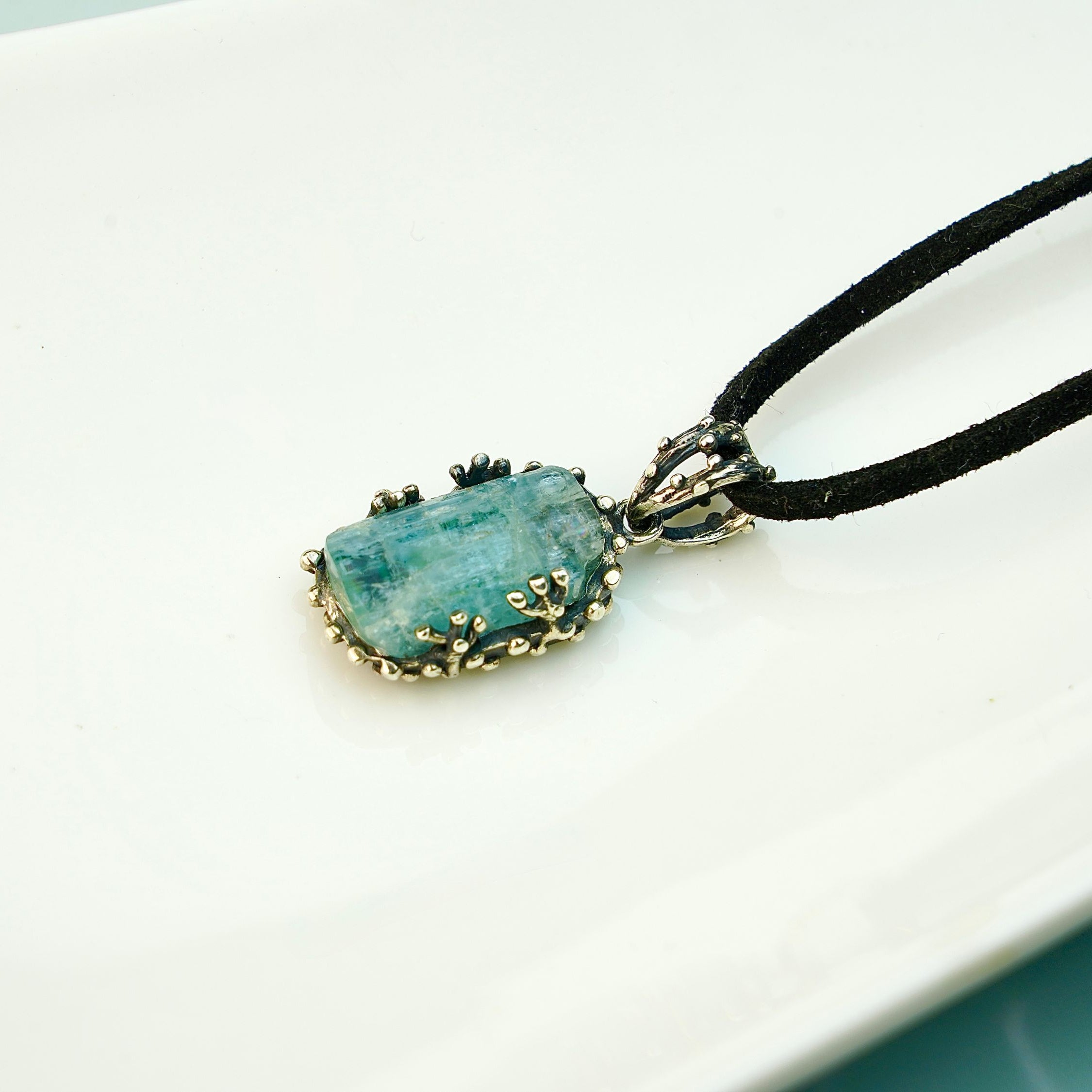 Lifestyle aquamarine necklace blue crystal jewelry minimal aesthetic composition
