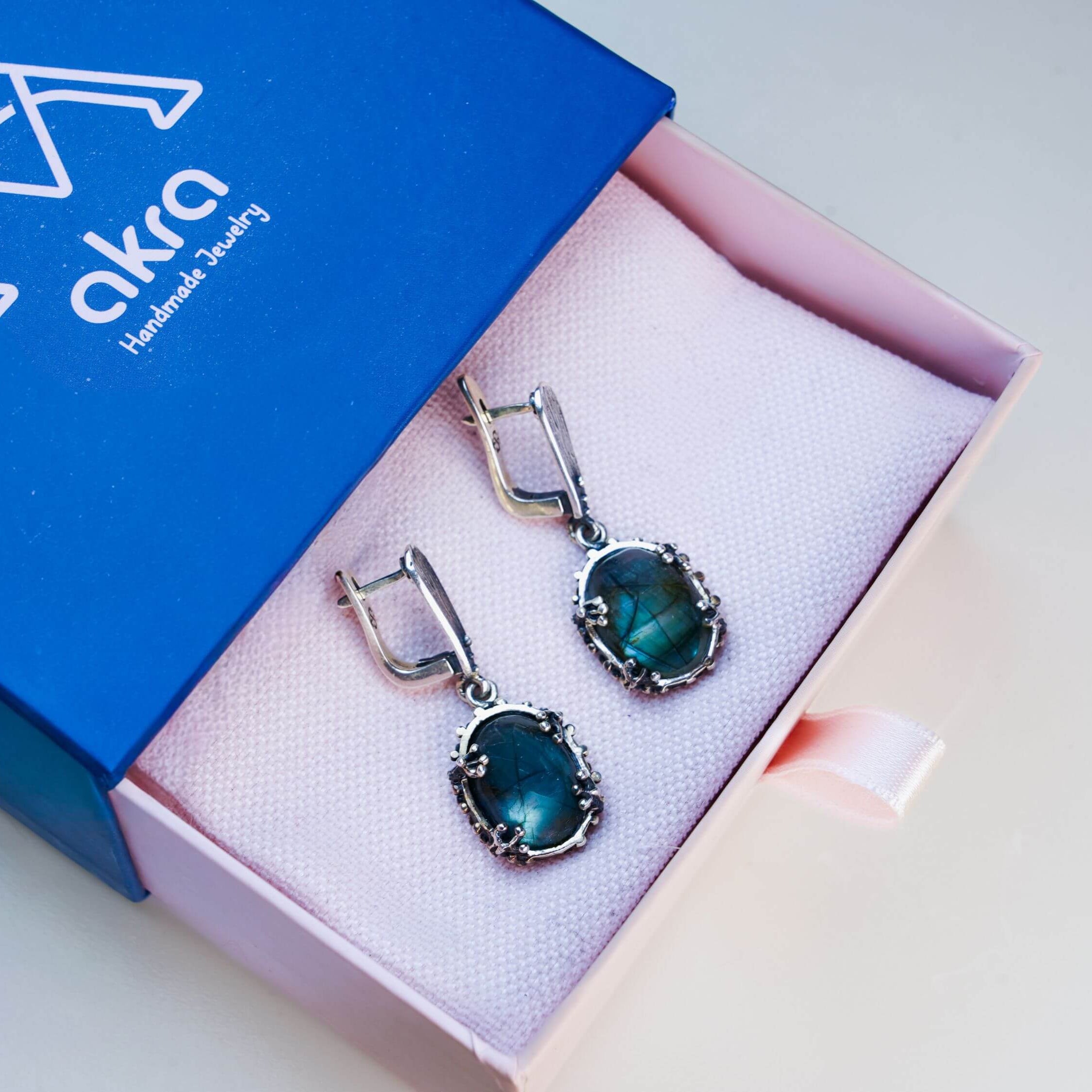 Luxury Akra Gems branded jewelry box with a labradorite gift, perfect for special occasions