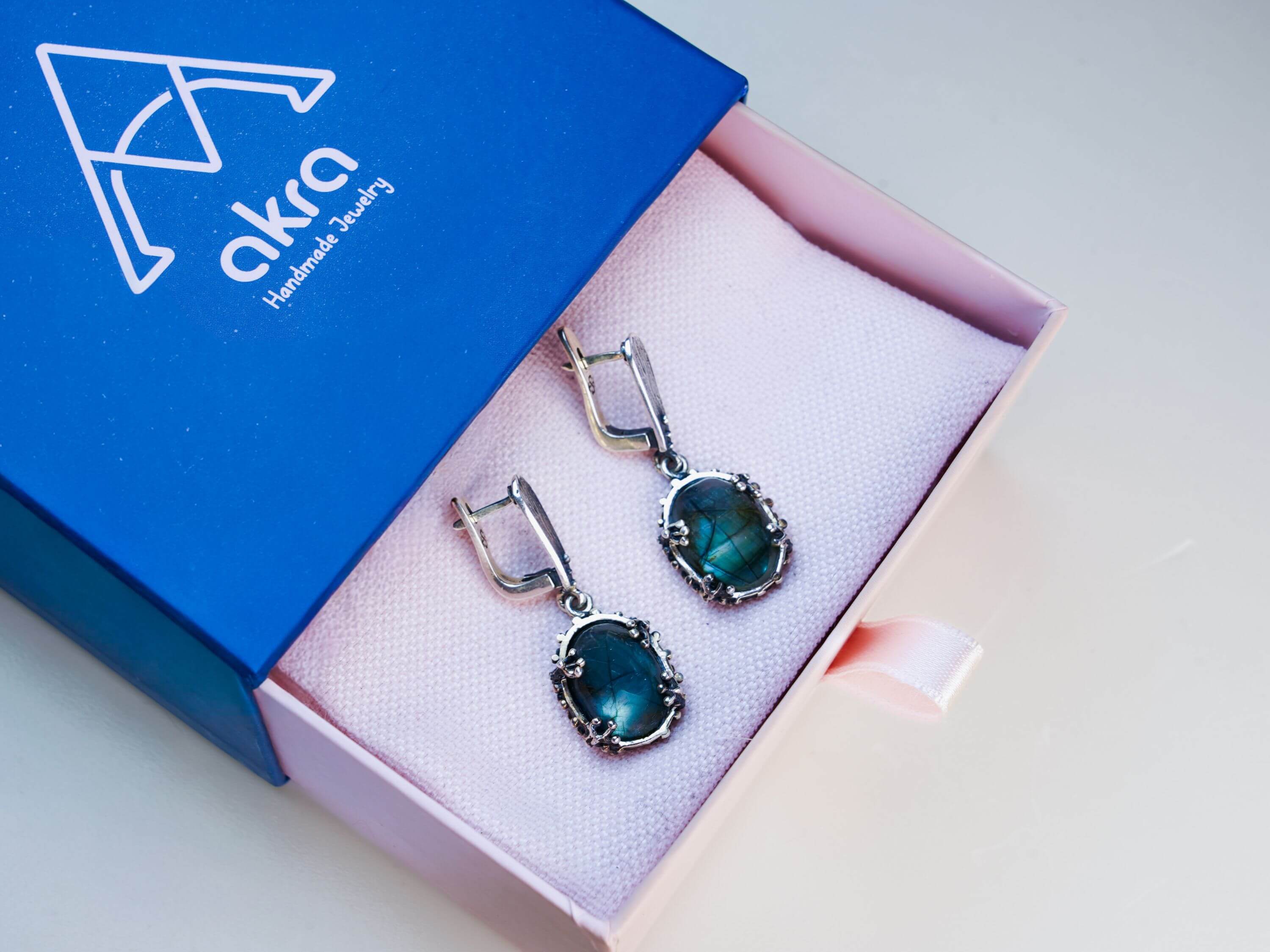 Luxury Akra Gems branded jewelry box with a labradorite gift, perfect for special occasions