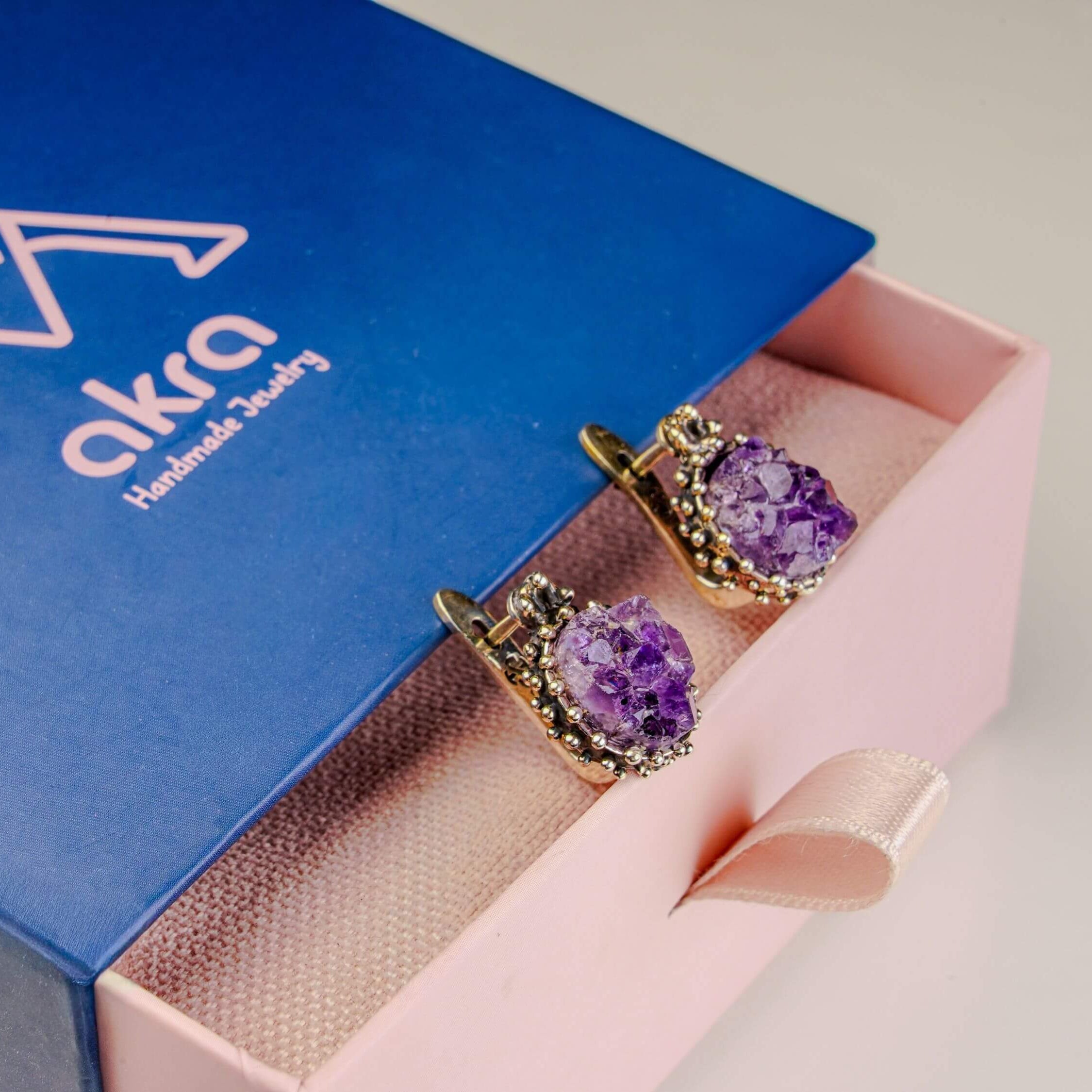 Amethyst earrings inside Akra Gems signature gift box, ready for premium gifting