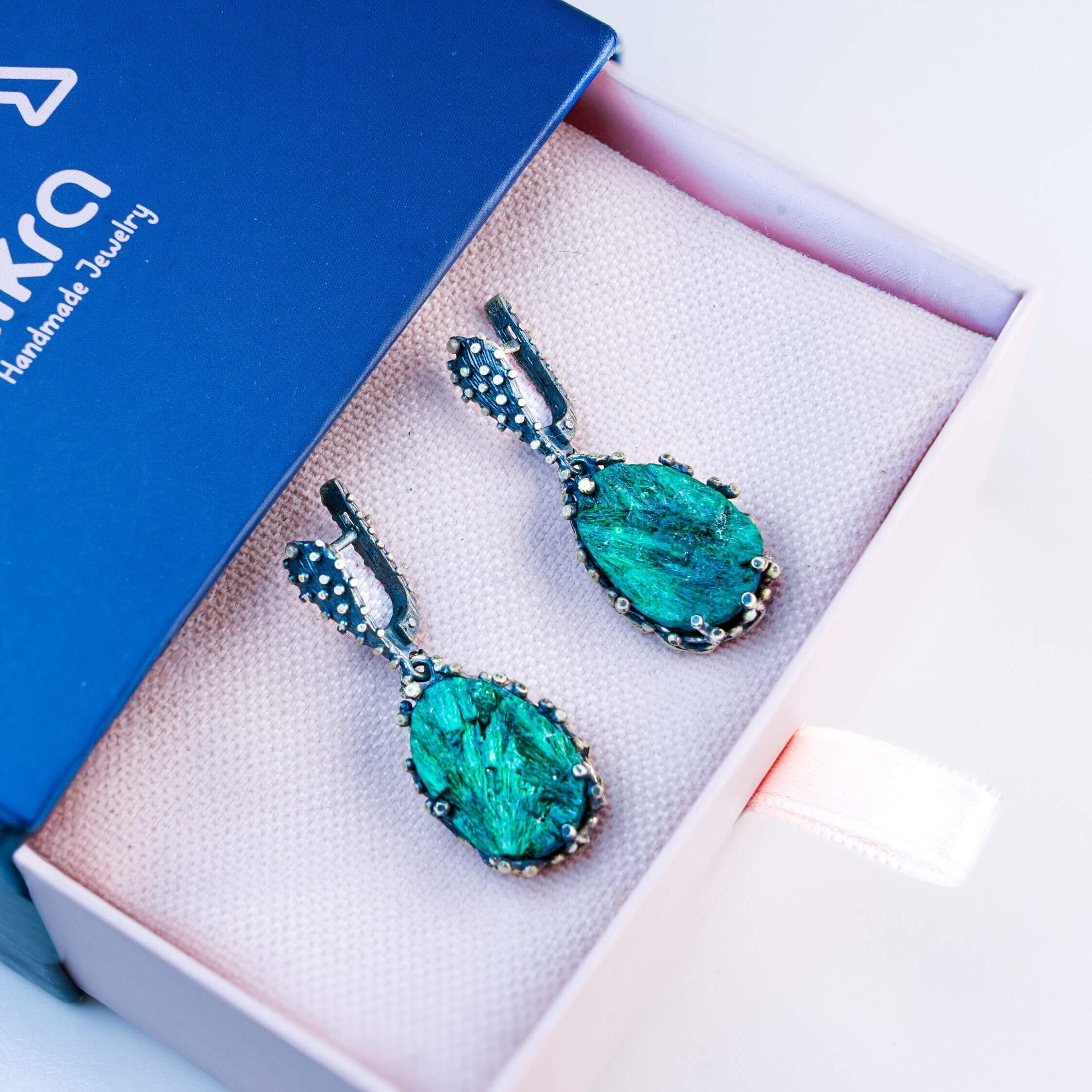 Malachite earrings inside Akra Gems signature gift box, ready for premium gifting