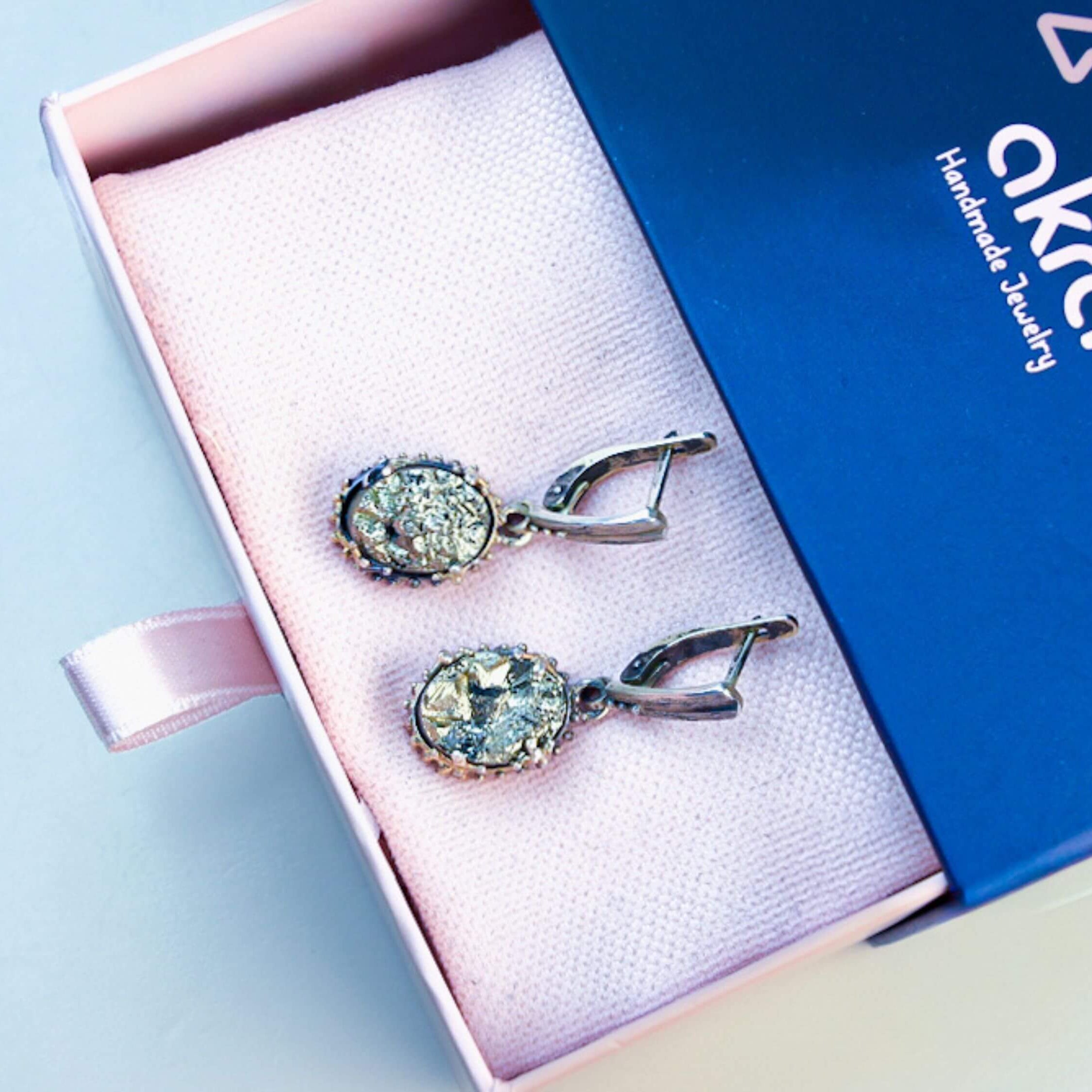 Golden Pyrite earrings inside an Akra Gems signature gift box, elegantly presented and ready for premium gifting