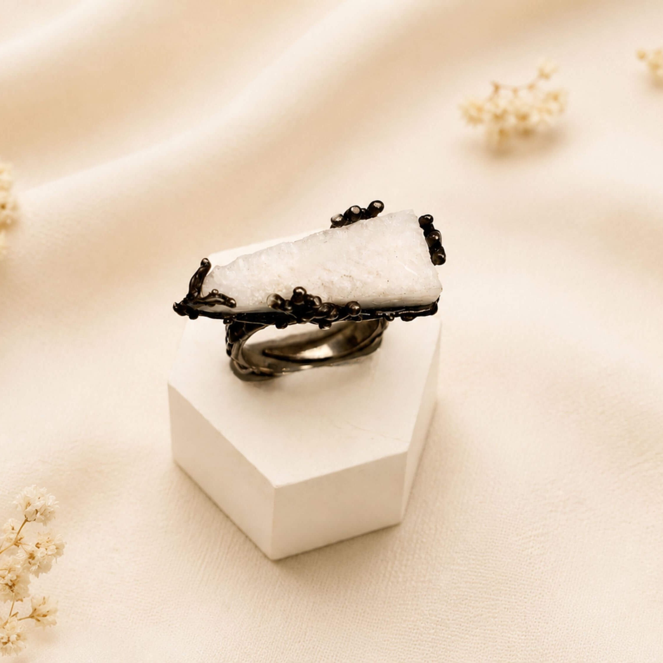 Handcrafted Moonstone jewelry by Akra Gems, showcasing the fusion of raw natural elements and bold artisan metalwork.