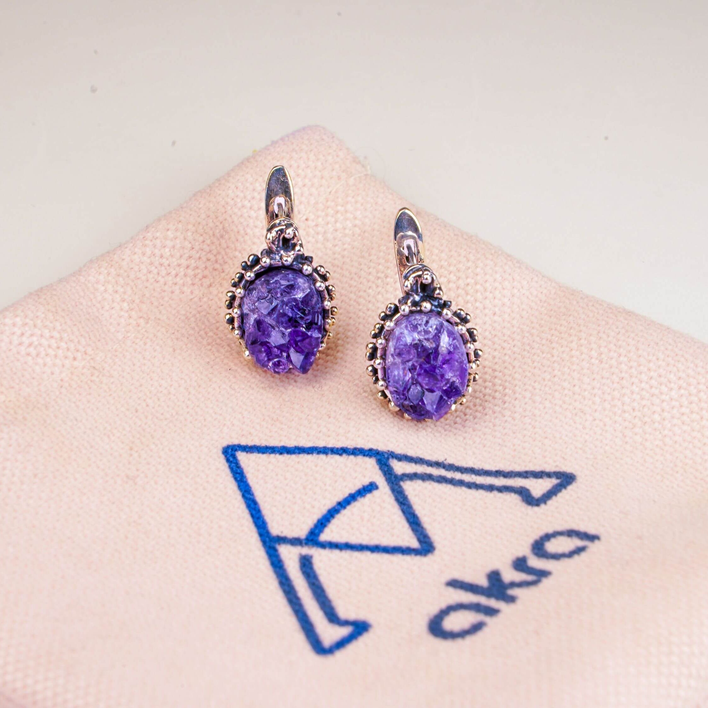 Artistic lifestyle shot of purple amethyst jewelry, capturing its mystical and sophisticated nature-inspired vibe