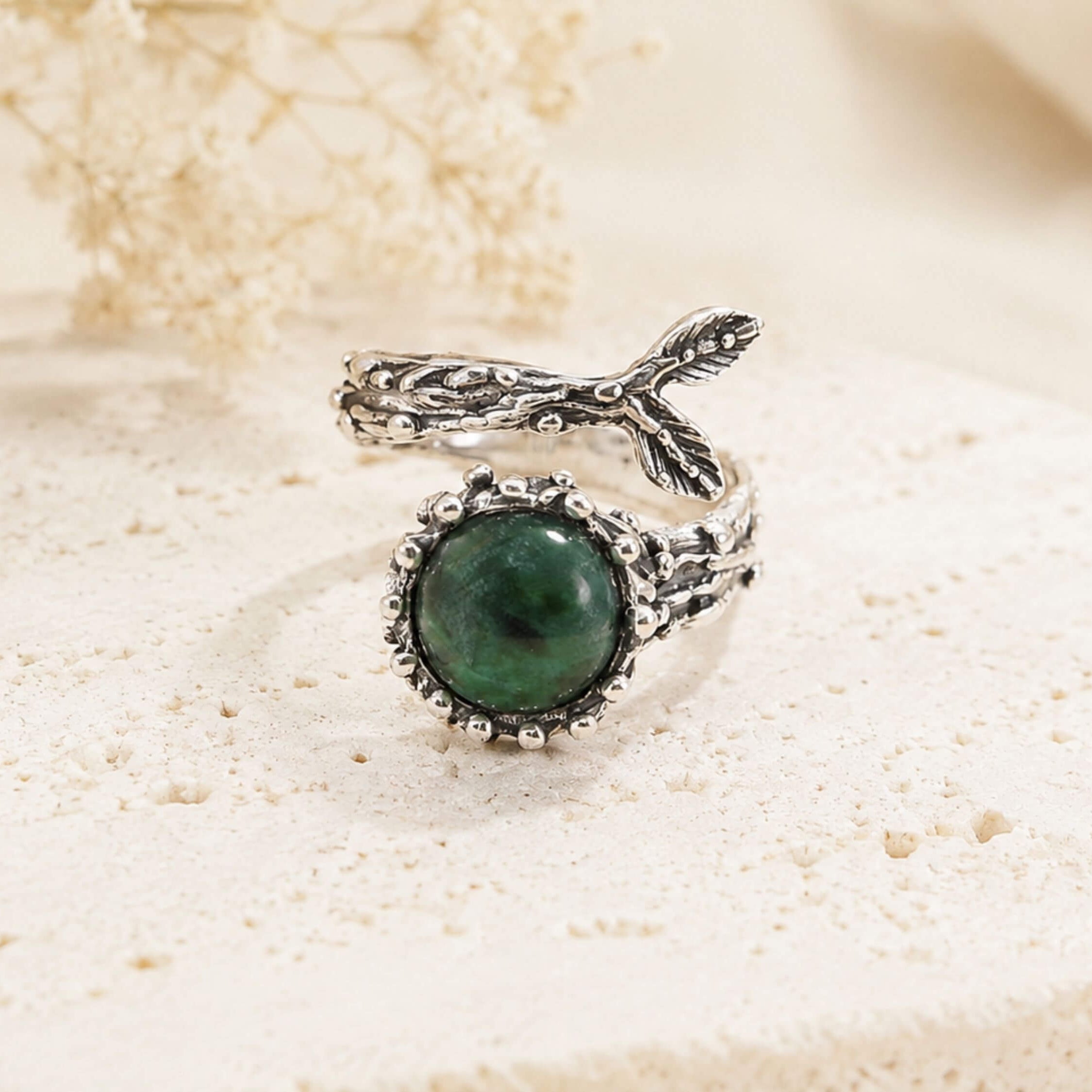 Top-down view of the Jade gemstone ring, emphasizing the unique, one-of-a-kind shape of the natural raw crystal.