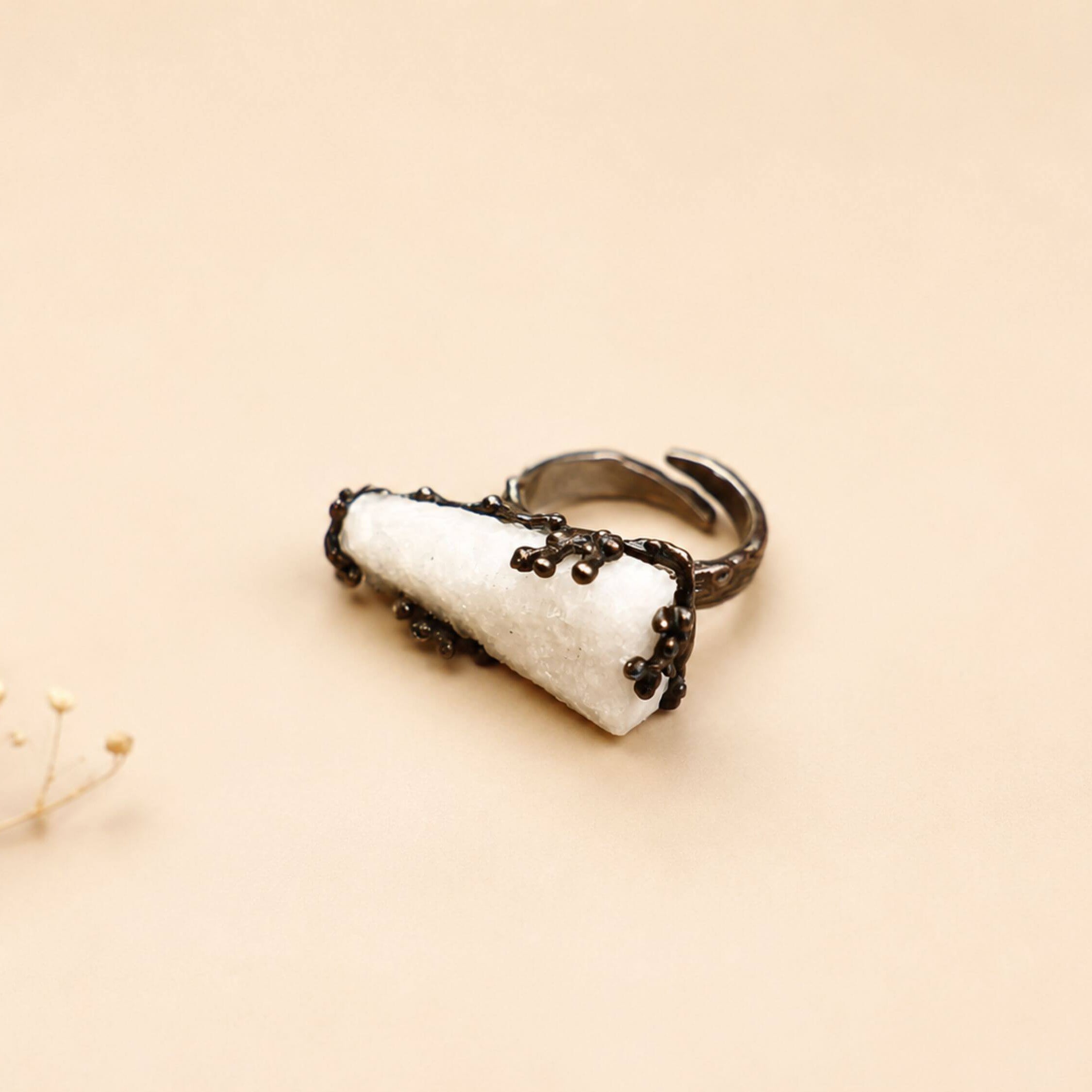 Front-facing view of the raw crystal ring, highlighting the asymmetrical, one-of-a-kind shape of the natural moonstone.