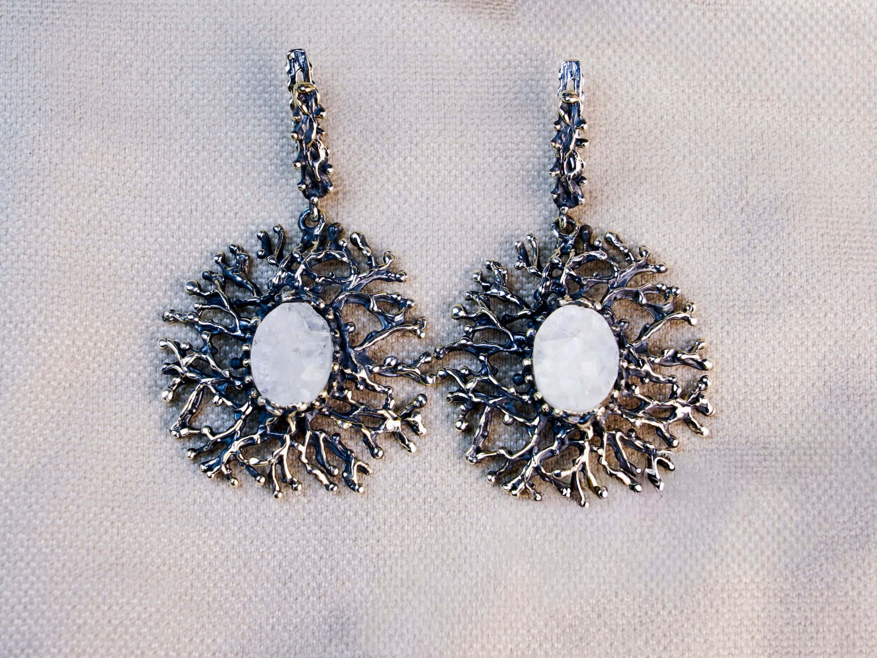 Symmetrical front view of both Moonstone earrings, emphasizing the unique, nature-inspired sterling silver textures and stone clarity