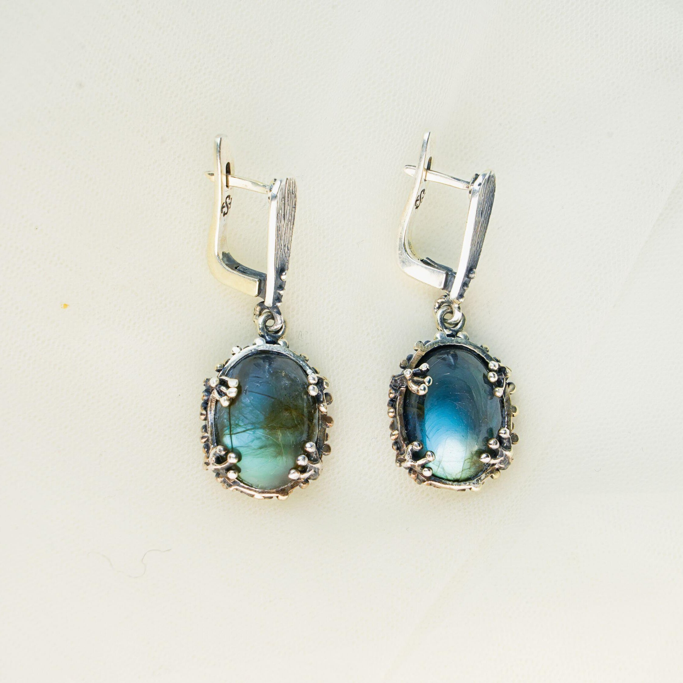 Close-up shot of natural labradorite stone with intense blue labradorescence and unique mineral texture