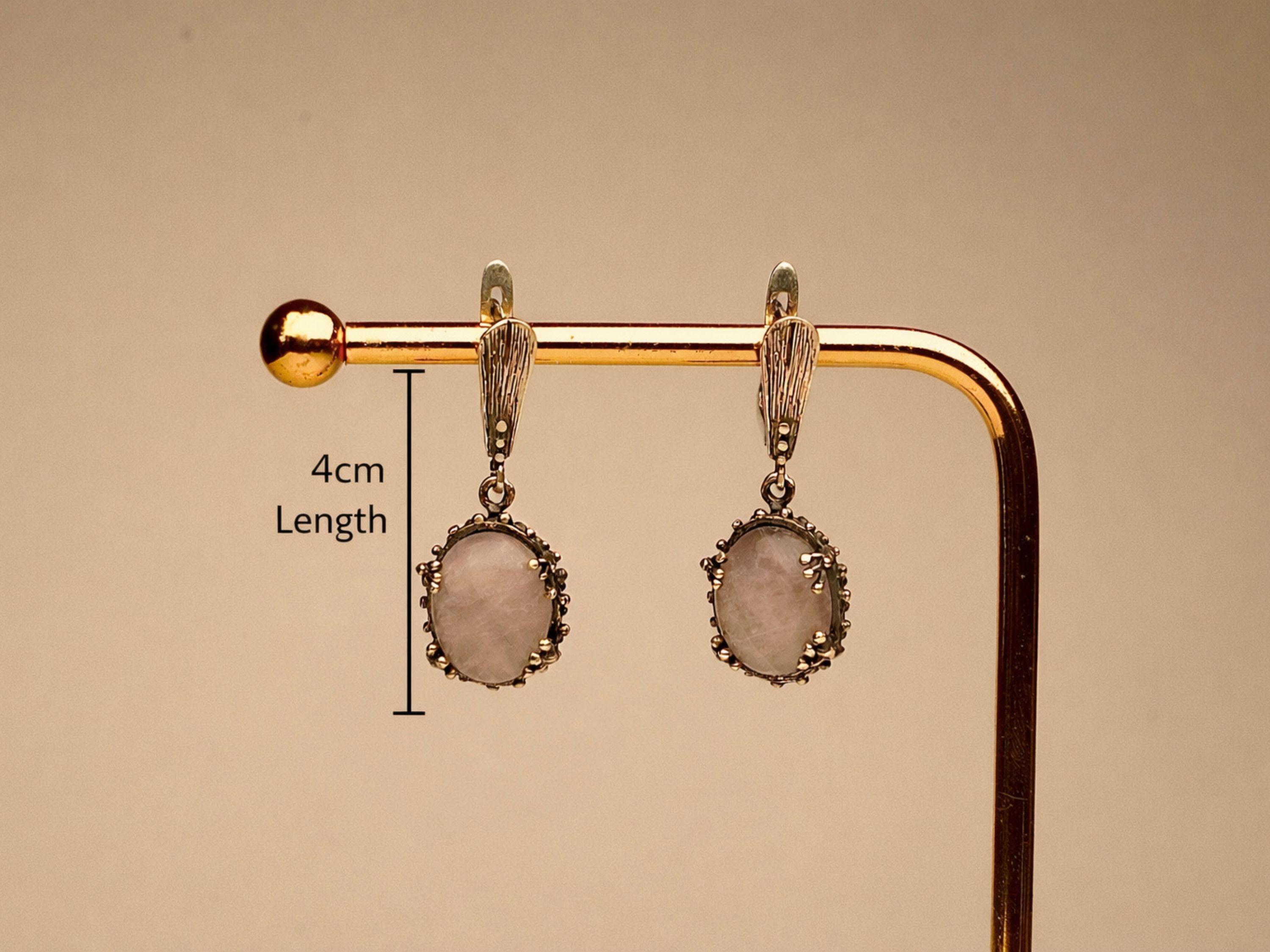 rose quartz earrings in gift box, elegant jewelry packaging ready for gift