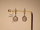 rose quartz earrings in gift box, elegant jewelry packaging ready for gift