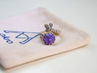 Amethyst ring on branded fabric minimalist jewelry aesthetic presentation