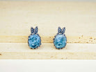 Handmade light blue aquamarine earrings in ornate silver setting by Akra Gems