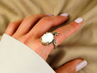 Moonstone ring worn on hand adjustable sterling silver glowing gemstone