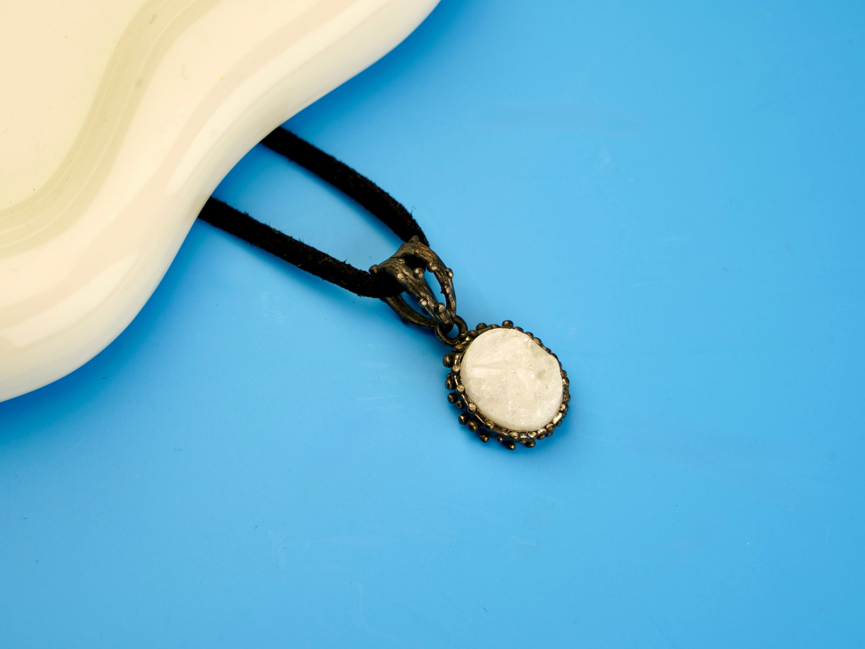 moonstone pendant necklace on display, white gemstone sterling silver jewelry