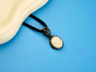 moonstone pendant necklace on display, white gemstone sterling silver jewelry