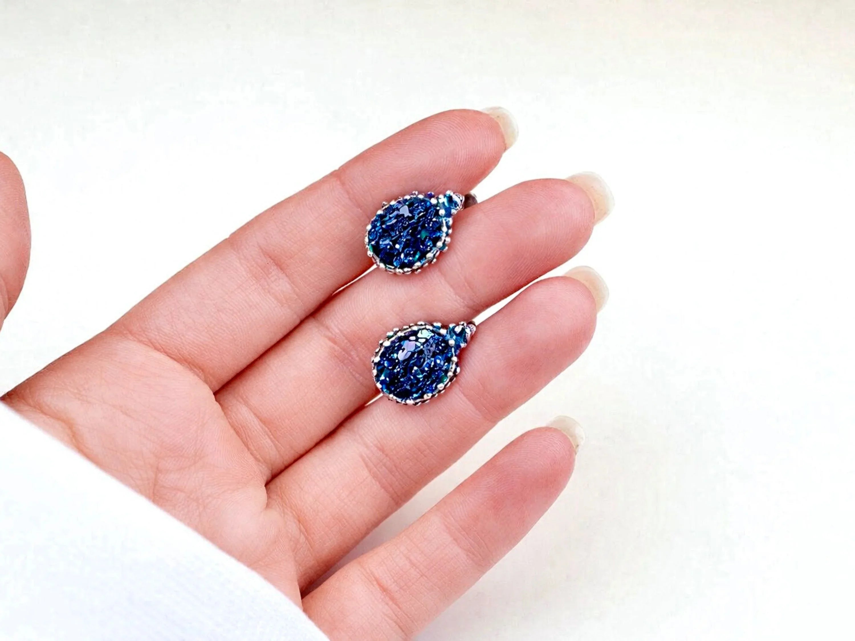 Black moissanite earrings on hand size reference sterling silver leverback