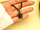 jade necklace on hand size reference green stone pendant