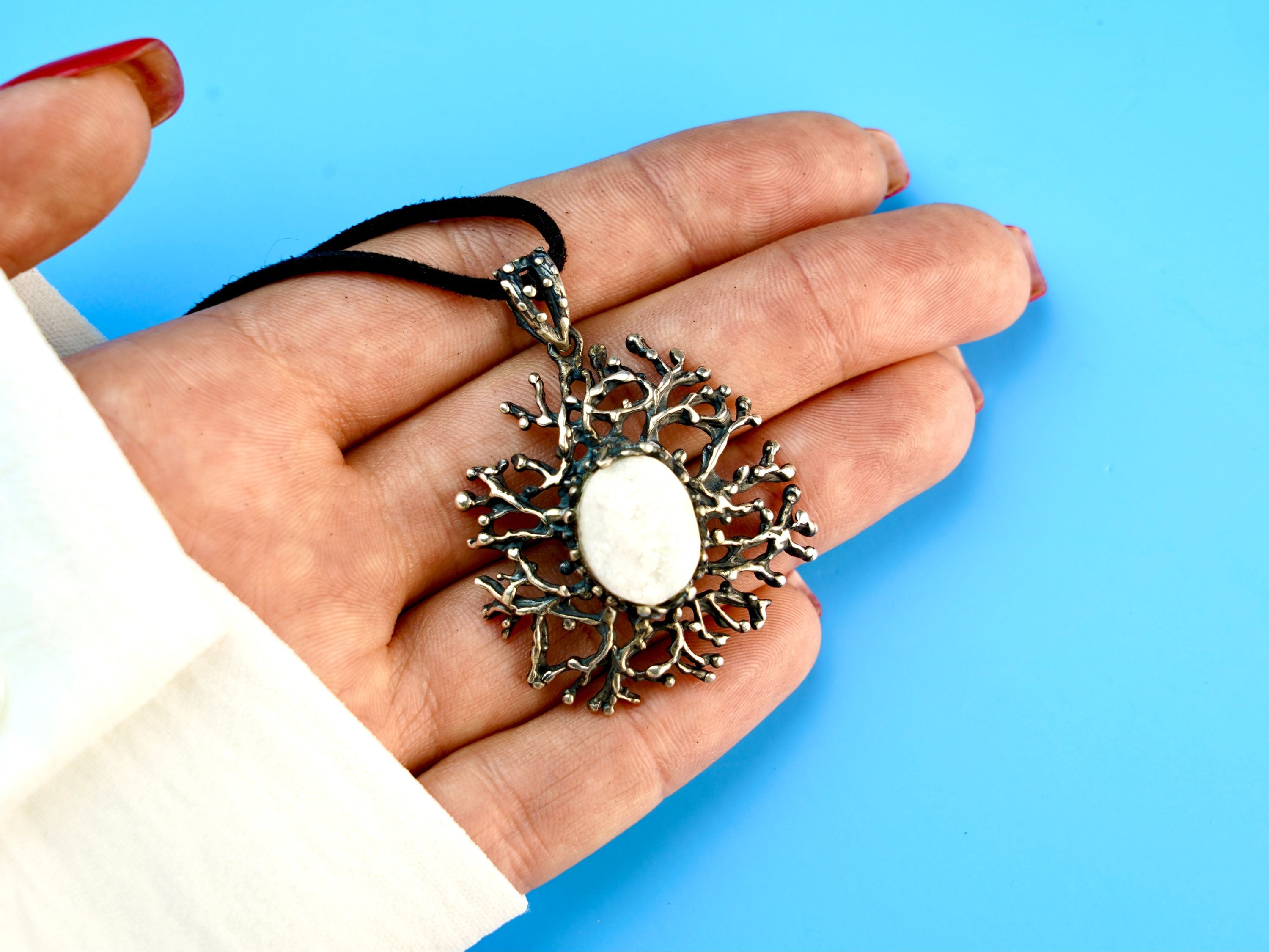 moonstone statement necklace on hand, size reference large artistic pendant
