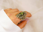 Statement gothic labradorite ring worn on hand showcasing the blue-green gemstone glow
