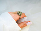 Pyrite ring worn on hand raw gold stone sterling silver statement jewelry