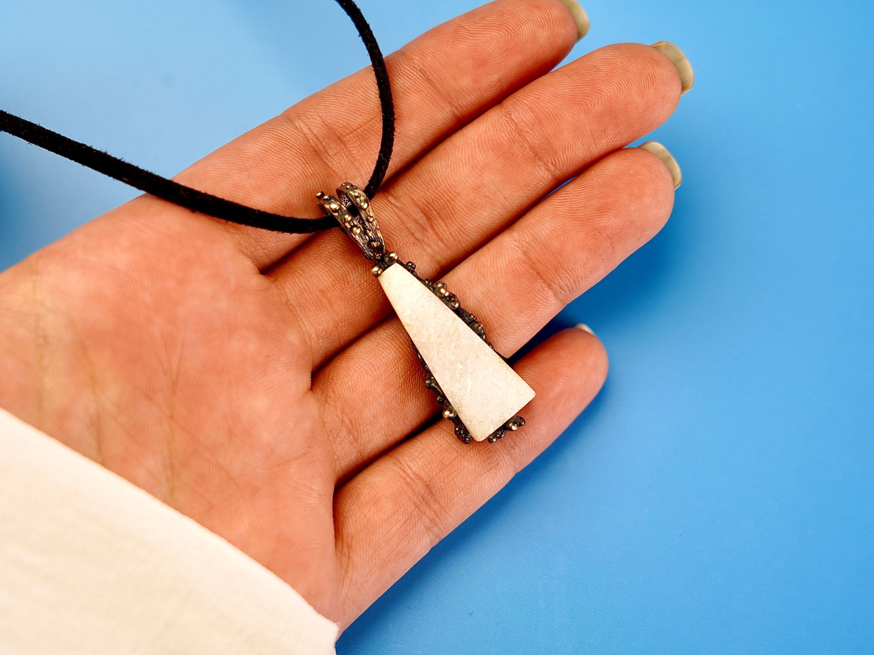 Moonstone pendant on hand size reference raw white gemstone silver necklace