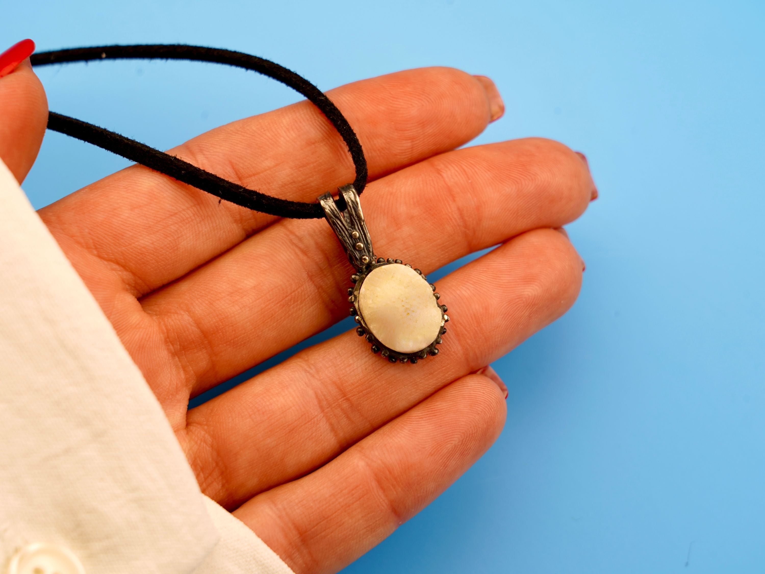 moonstone necklace on hand glowing pendant silver jewelry