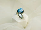 Aquamarine ring angled view sterling silver adjustable blue gemstone ring